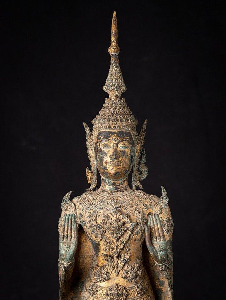 Material: bronze
68,8 cm high 
16,5 cm wide and 16 cm deep
Weight: 7.161 kgs
Gilded with 24 krt. gold
Abhaya mudra
Originating from Thailand
19th century
Rattanakosin period.
 