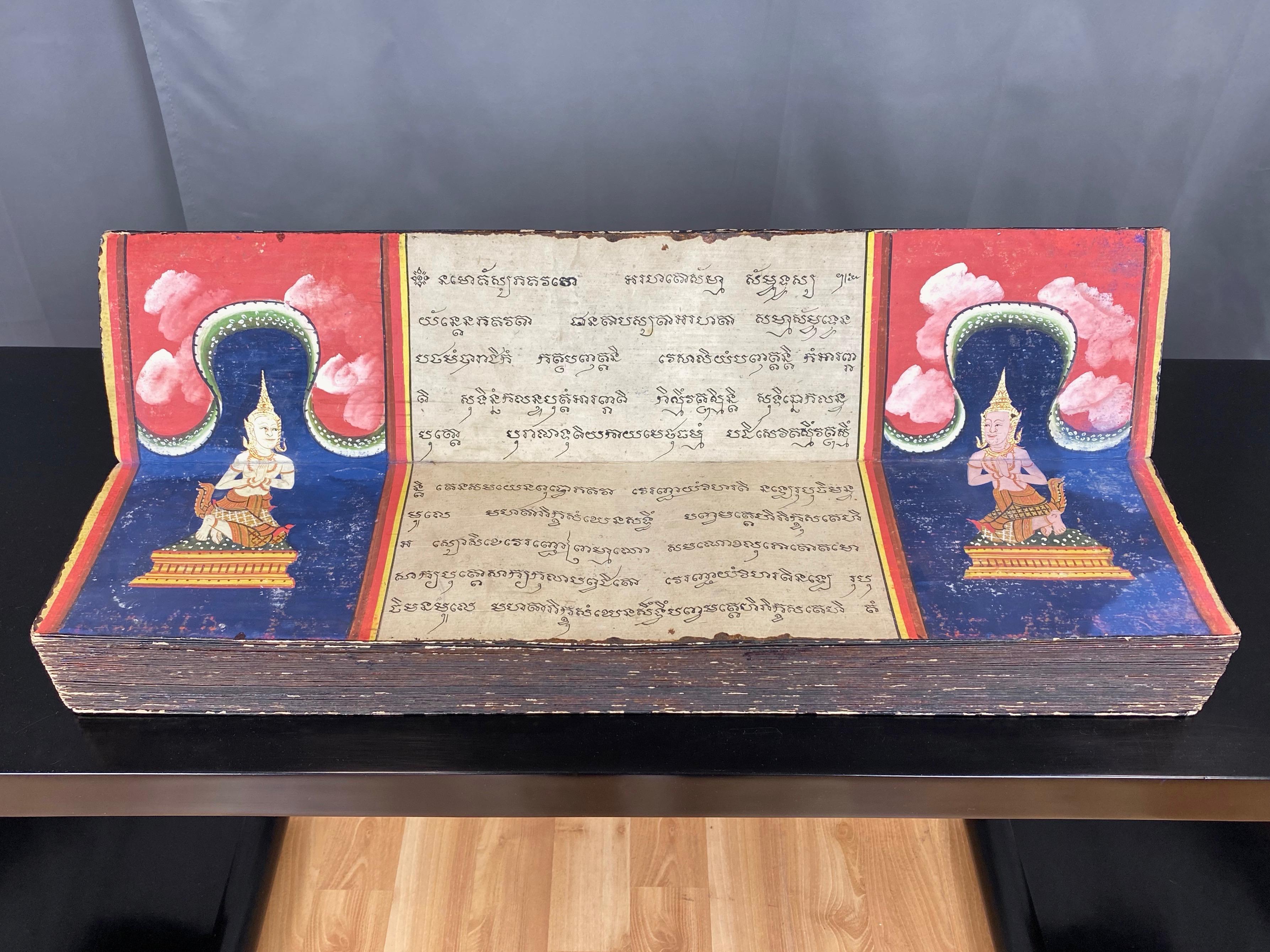 An uncommonly fine and rare mid-19th century Phra Malai illustrated Buddhist manuscript from Thailand.

Samut khoi accordion-style folding book with black lacquered paper covers featuring simple gold leaf decorations. Forty-four double-sided bi-fold