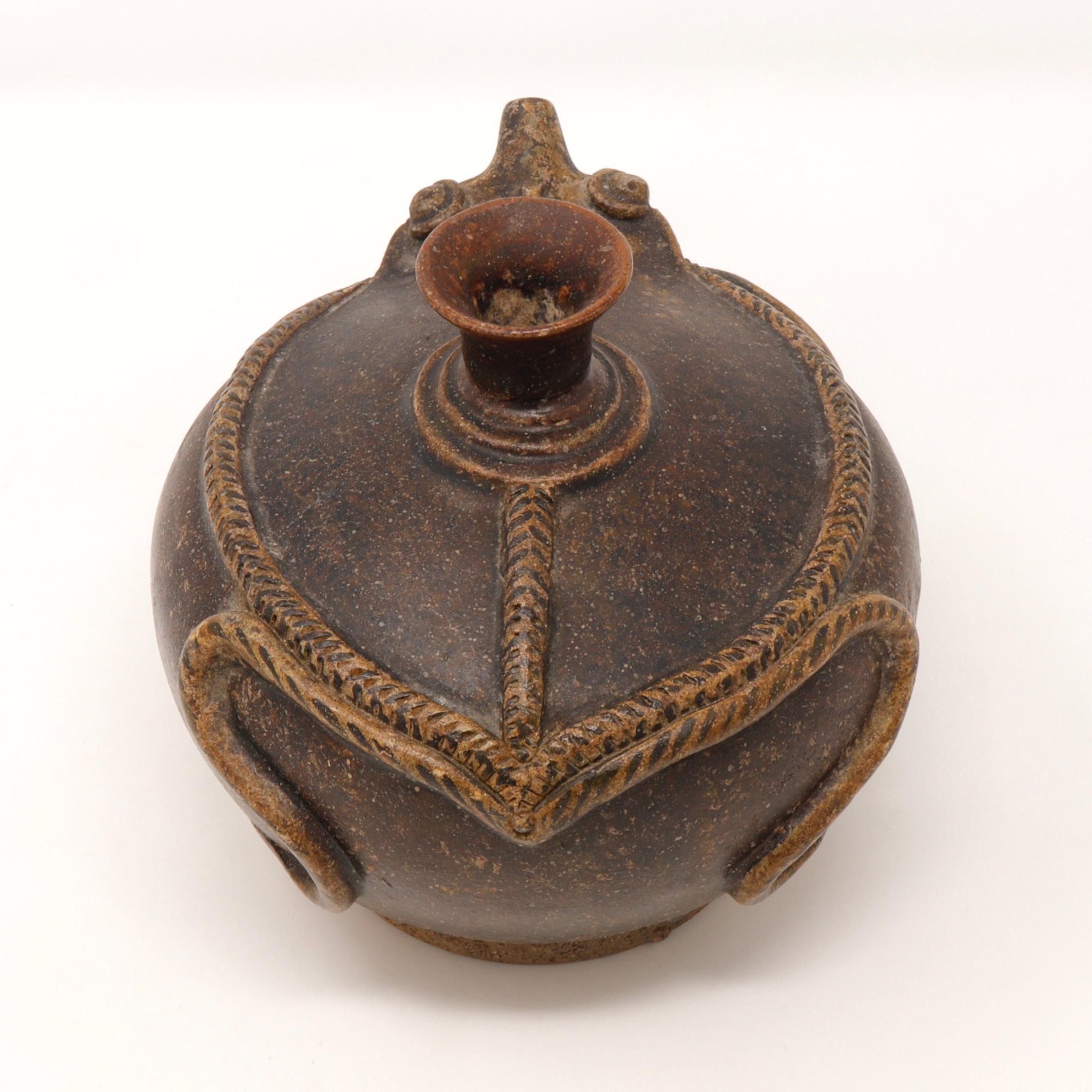 Antique Thai Frog Shaped Kendi, Sawankhalok Kilns, Si Satchanalai. 
A squat globular stoneware body of good size having a narrow upright neck and everted mouth. The short narrow spout has the shape of an imagined frog snout. The modeled details