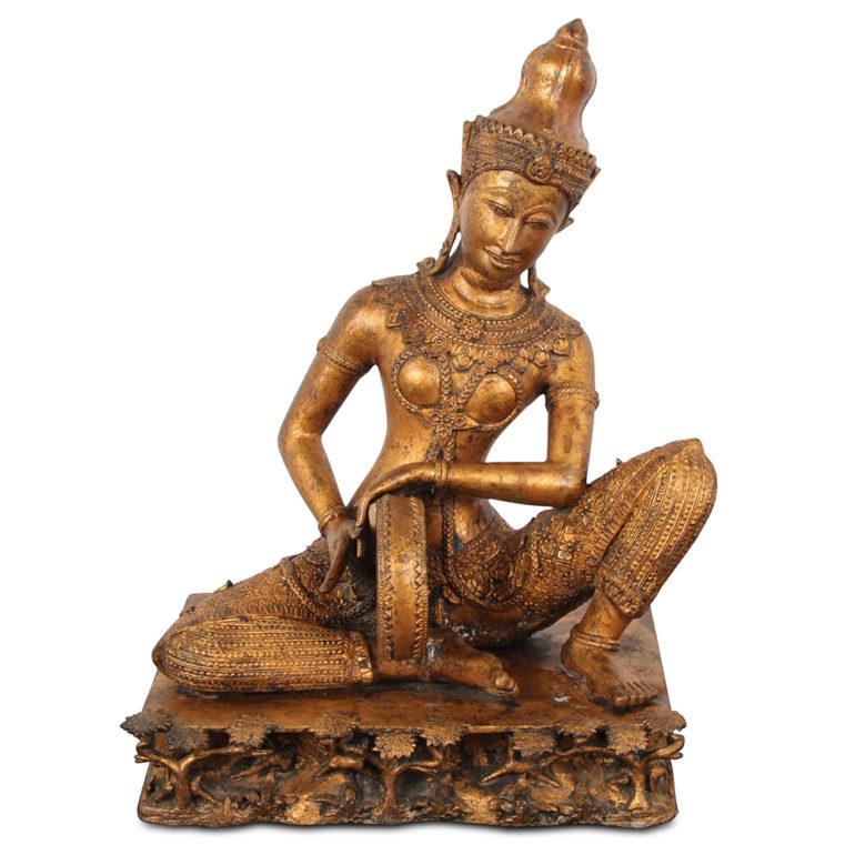 A set of three Thai gilt bronze seated musicians, one playing a drum, one a stringed instrument and the third playing a flute. All figures with elaborate and finely detailed costumes and jewelry, the bases with minute jungle scenes of animals and