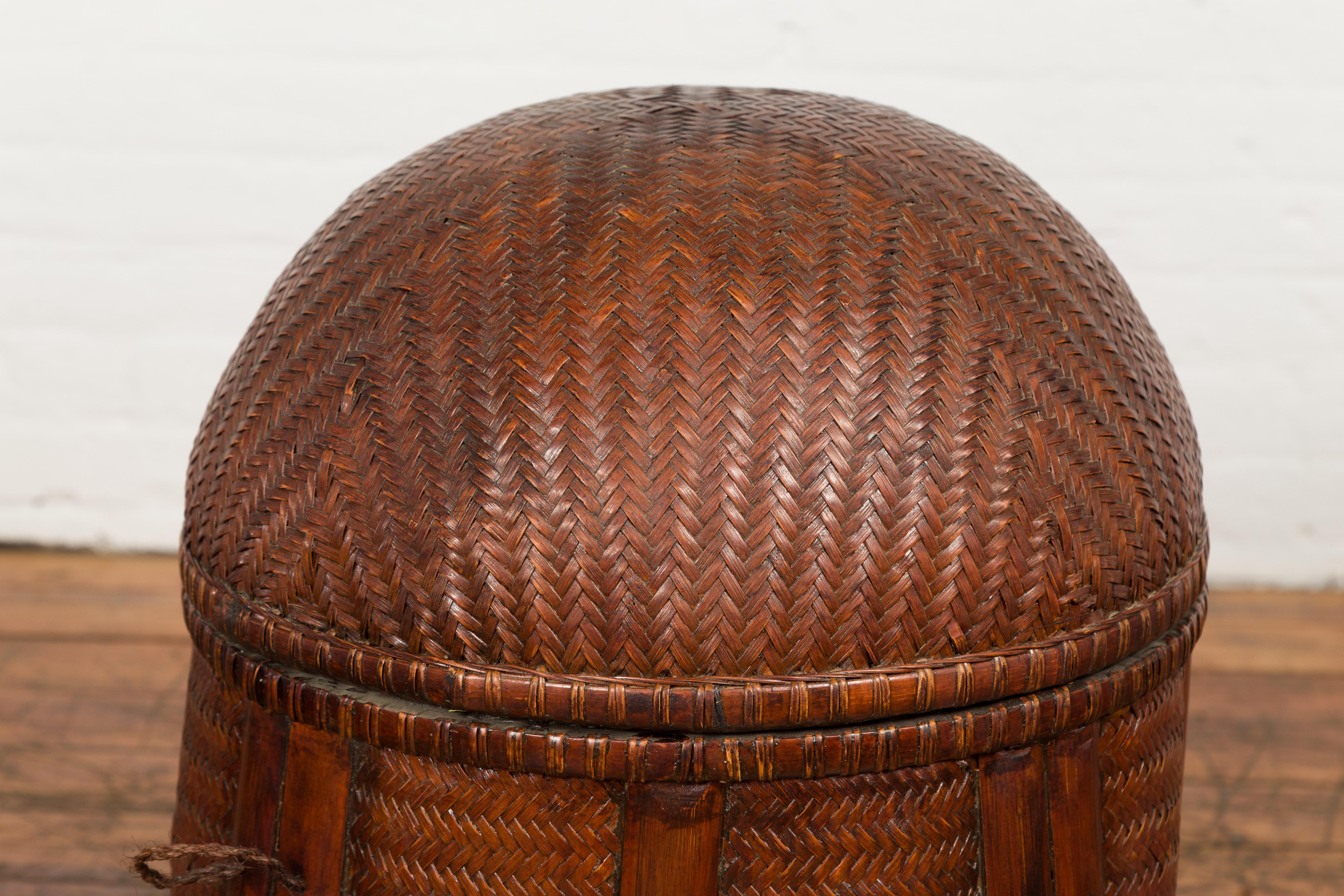 20th Century Antique Thai Hand Woven Rattan Basket with Domed Lid and Rustic Character For Sale
