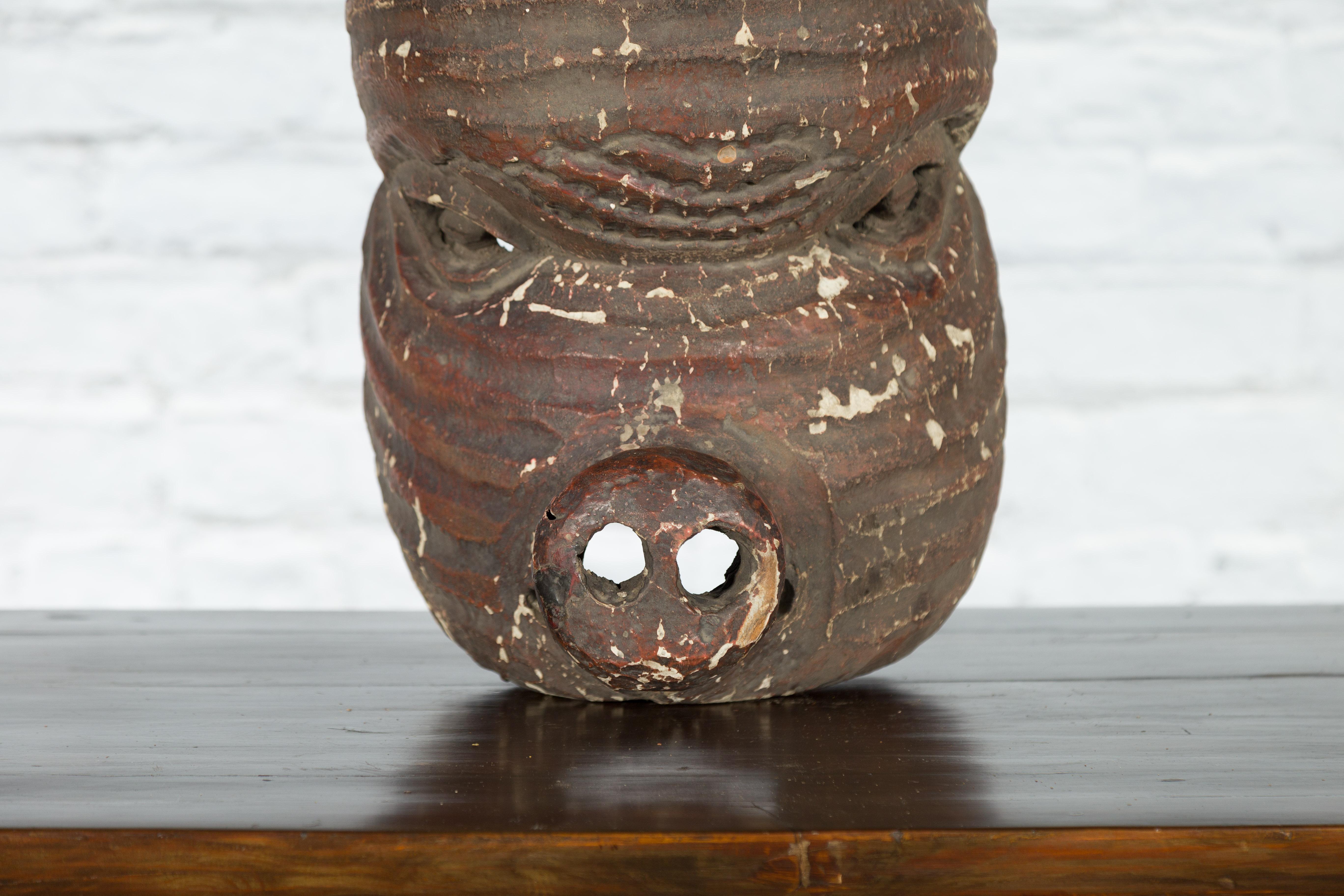 19th Century Antique Thai Tribal Carved Wooden Mask Depicting a Swine with Pierced Eyes For Sale