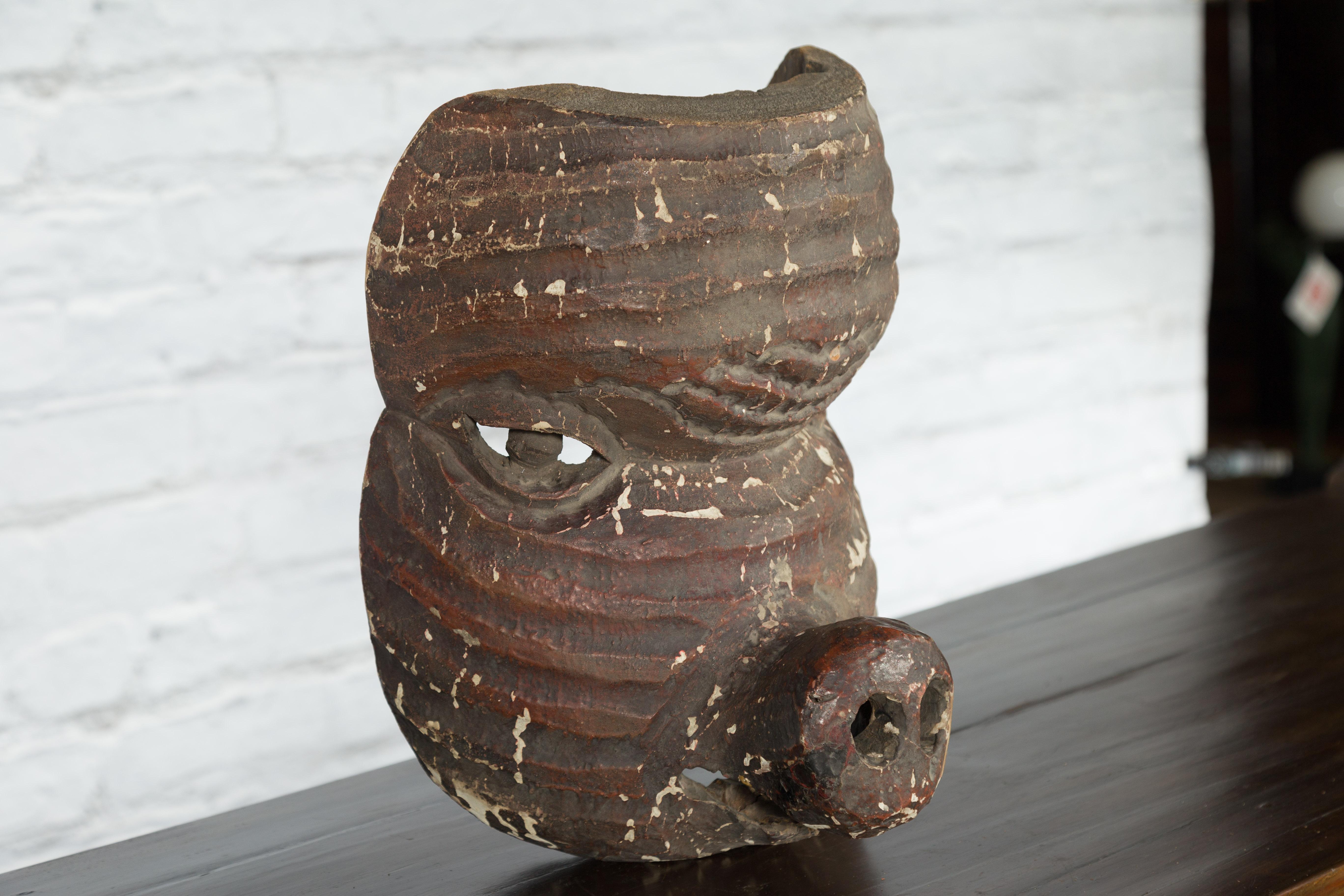 Antique Thai Tribal Carved Wooden Mask Depicting a Swine with Pierced Eyes For Sale 1