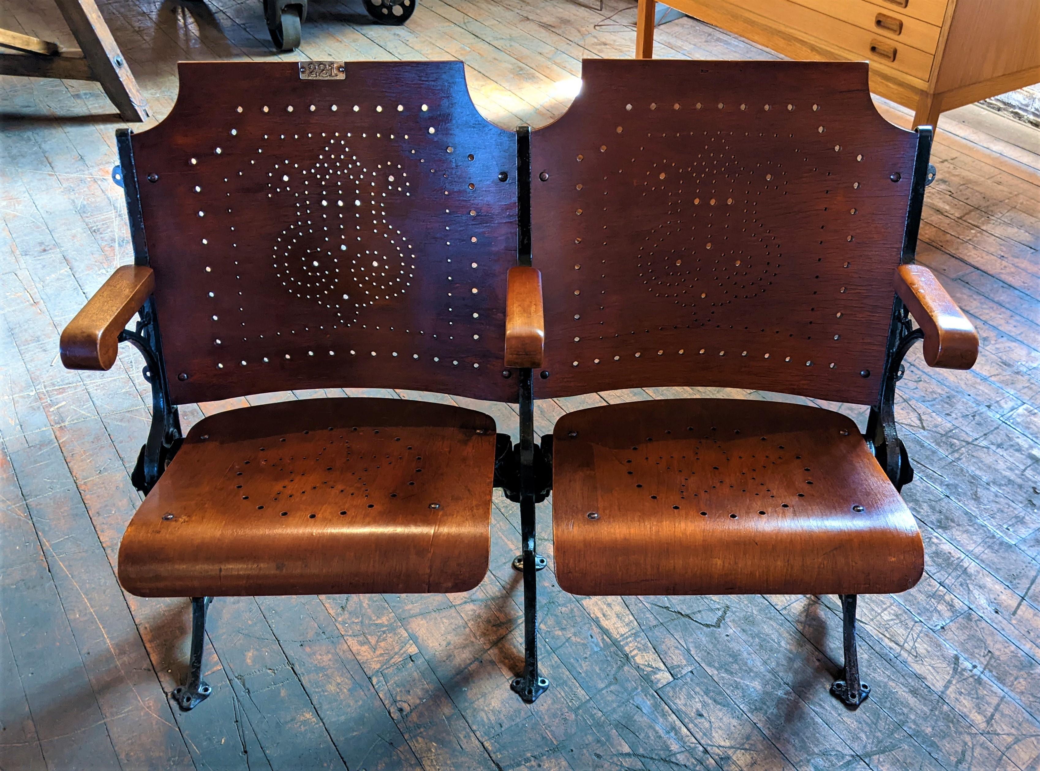 Antique cast iron & wood theater seats.

Overall Dimensions: 43 1/4