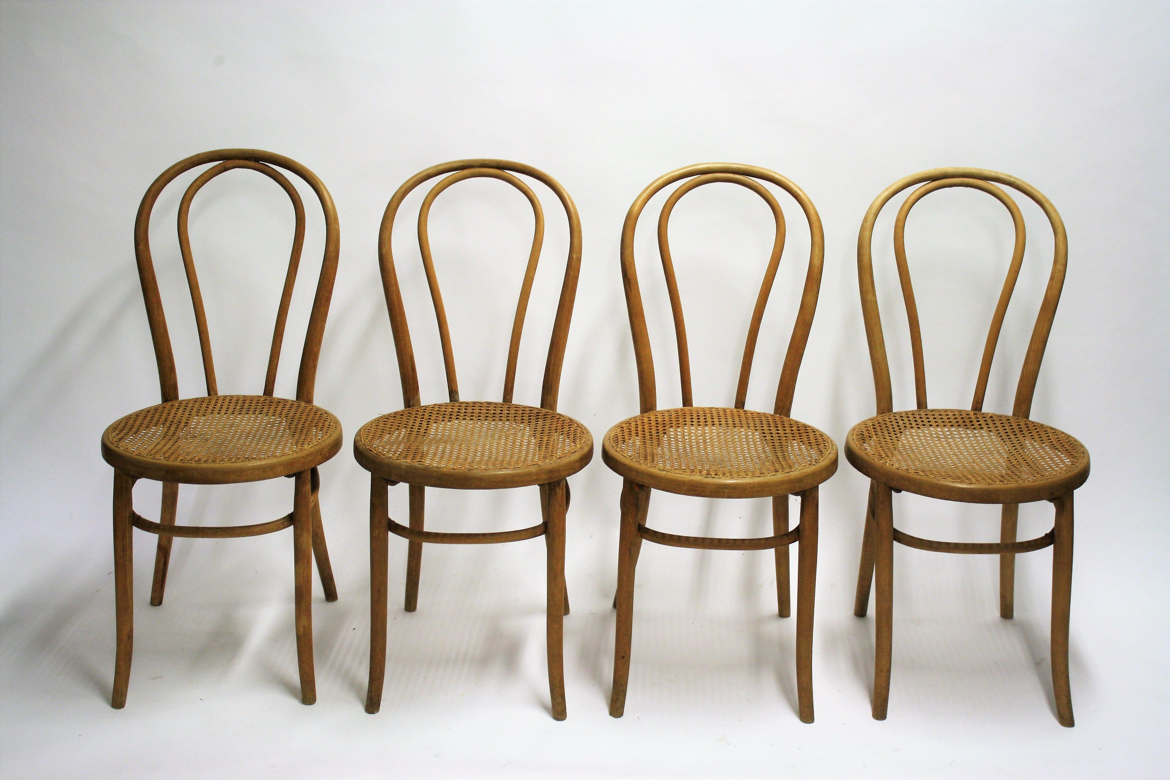 Set of 4 very early Thonet no. 18 dining chairs.

The chairs had some repairs but are still usable.

The use of very old screws shows the age of the chairs.

The cane seats are in good condition.

1920s - Romania

Dimensions:
Height