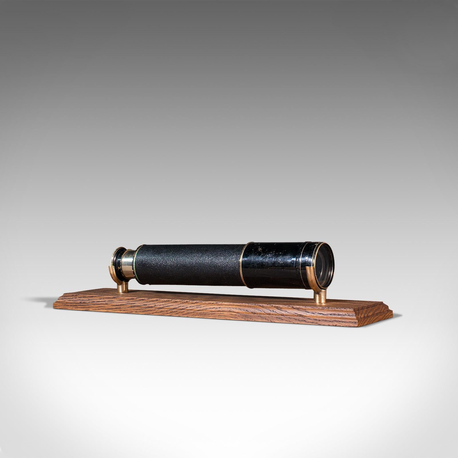 This is an antique three draw telescope. An English, brass terrestrial refractor by Ross of London, dating to the Edwardian period, circa 1910.

Perfect for bird watching, landscape appreciation, wildlife, or maritime observation. Equally suitable