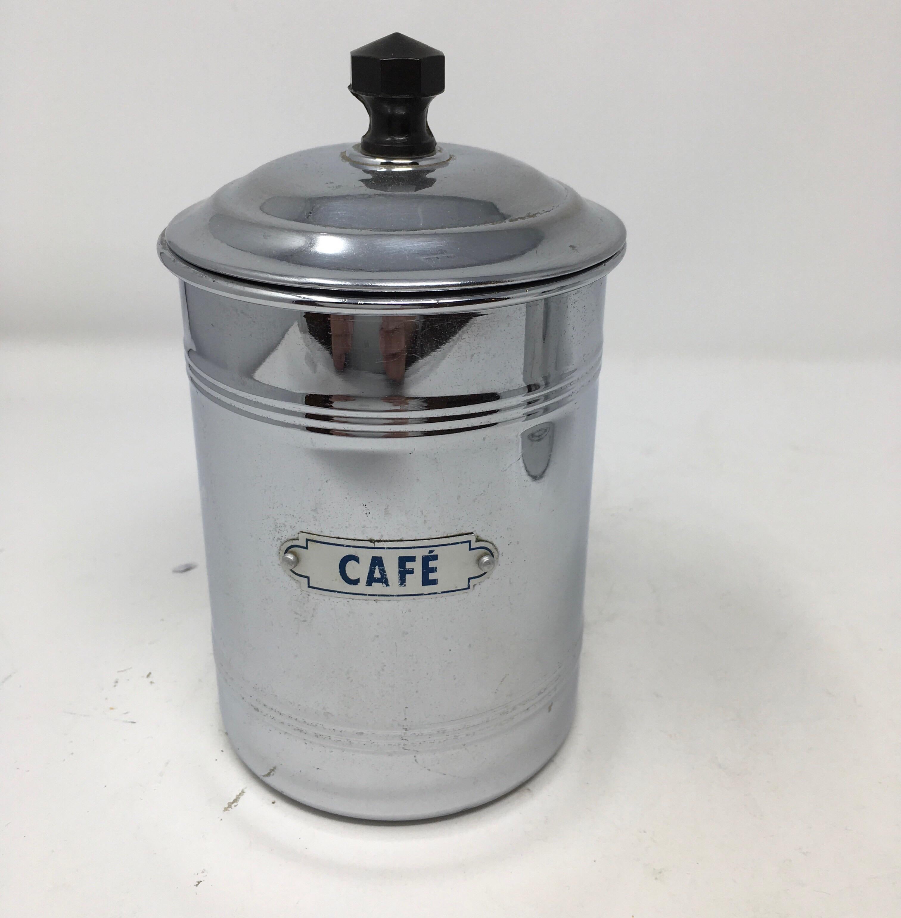 We found this French antique aluminum three-piece coffee set of canisters, circa 1920s in southern France. The charming canisters are complete with their original lids and black handles and name plates. Once a staple in every French kitchen, the