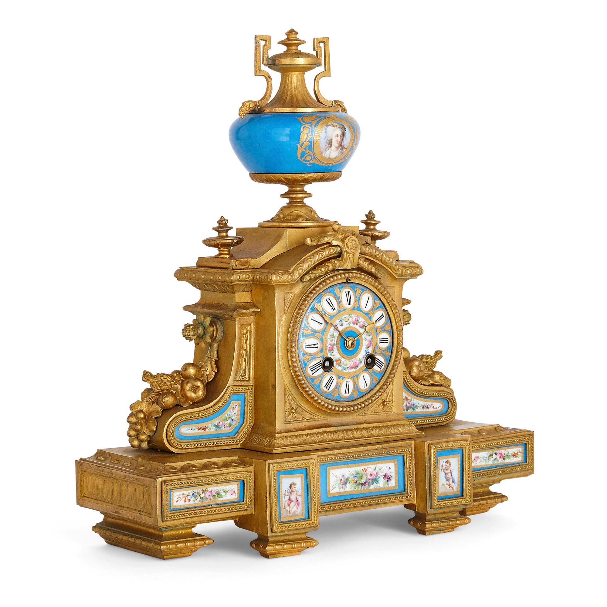 Antique Three-piece Louis XV and Sèvres style clock and ewer set
French, late 19th century
Dimensions: Height 36cm, width 34cm, depth 12cm

Consisting of a central mantel clock and pair of ewers, this beautifully ornate ormolu clock set is