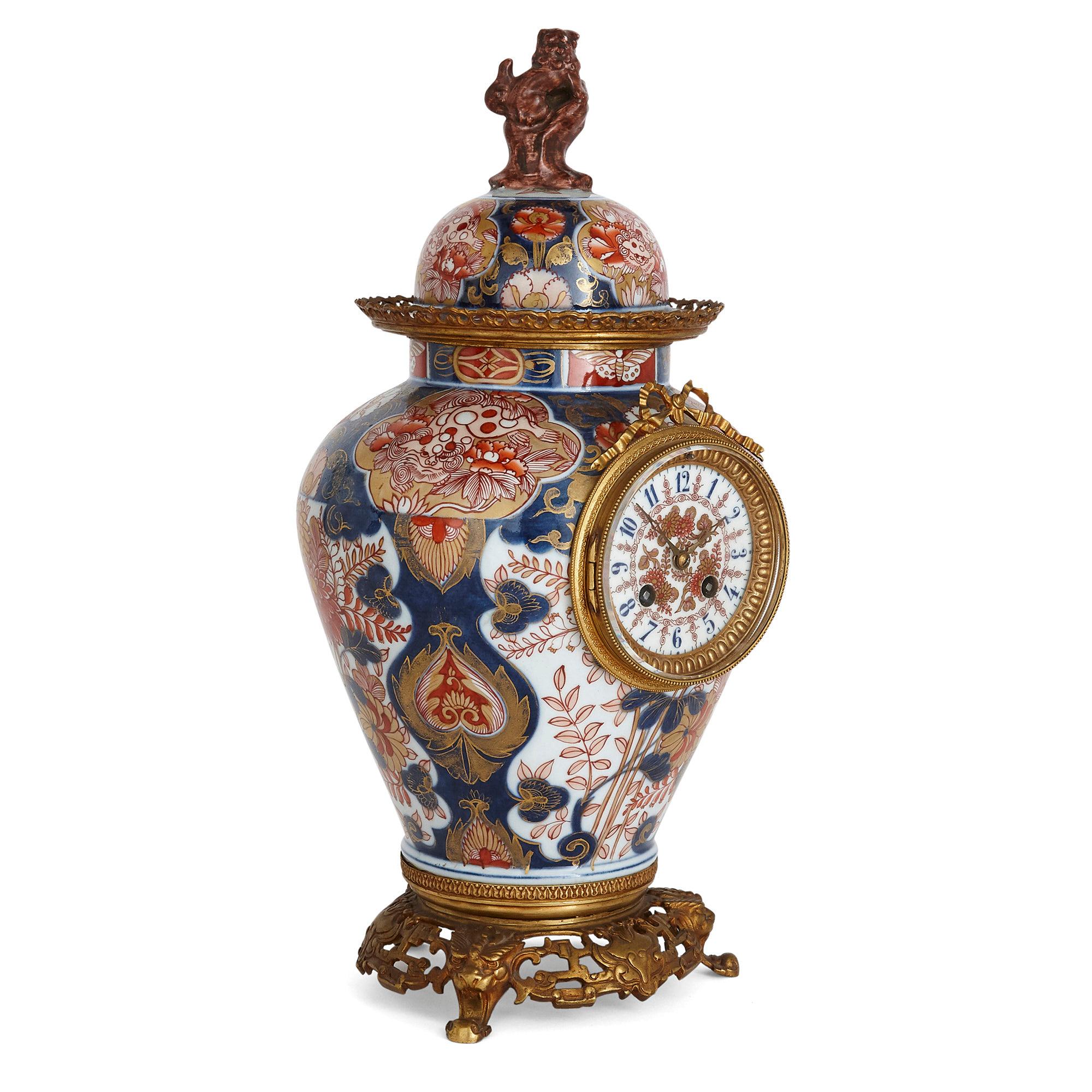 Antique three-piece Meiji period Japonisme vase clock set
French/Japanese, late 19th century
Measures: Clock height 47cm, diameter 22cm
Candelabra height 55cm, width 25cm, depth 25cm

Consisting of a central vase-form mantel clock and two