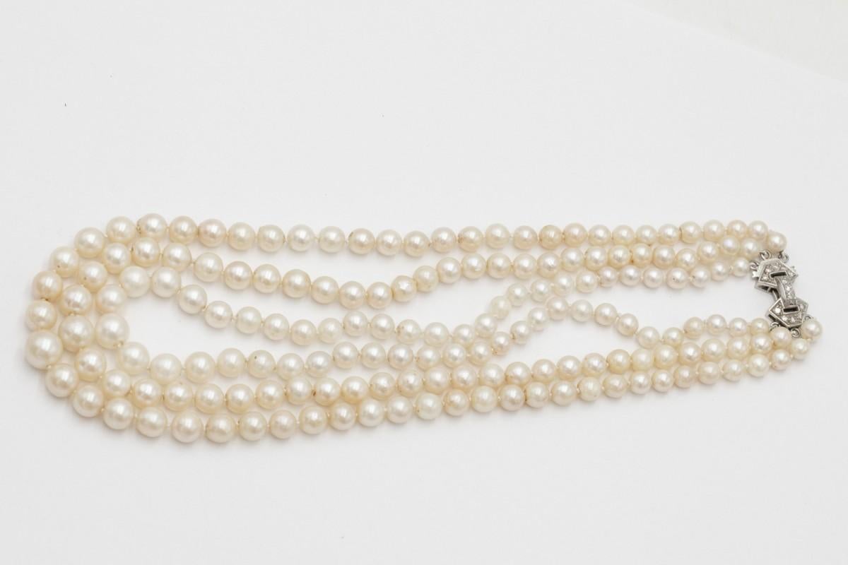 Antique three-row pearl necklace with a platinum clasp and diamonds. For Sale 1