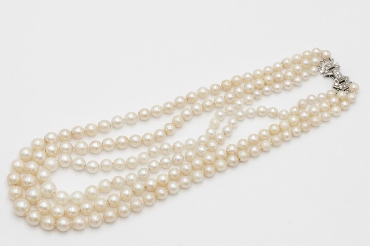 Antique three-row pearl necklace with a platinum clasp and diamonds. For Sale 3