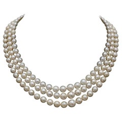 Antique three-row pearl necklace with a platinum clasp and diamonds.