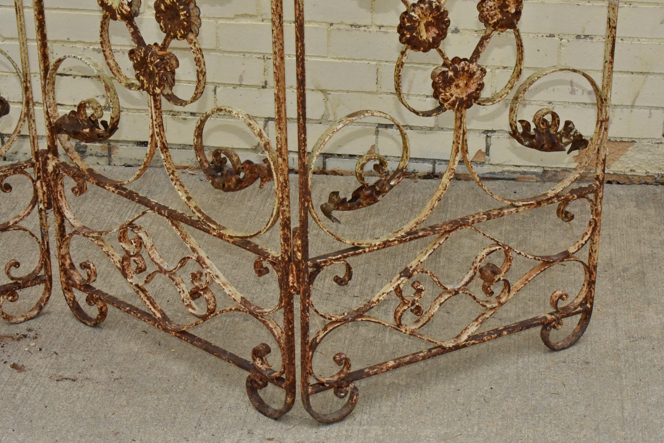 Antique Three Section Folding Screen. Circa 1940's. Iron rustic condition, hinged screen with three panels. Each panel is 20