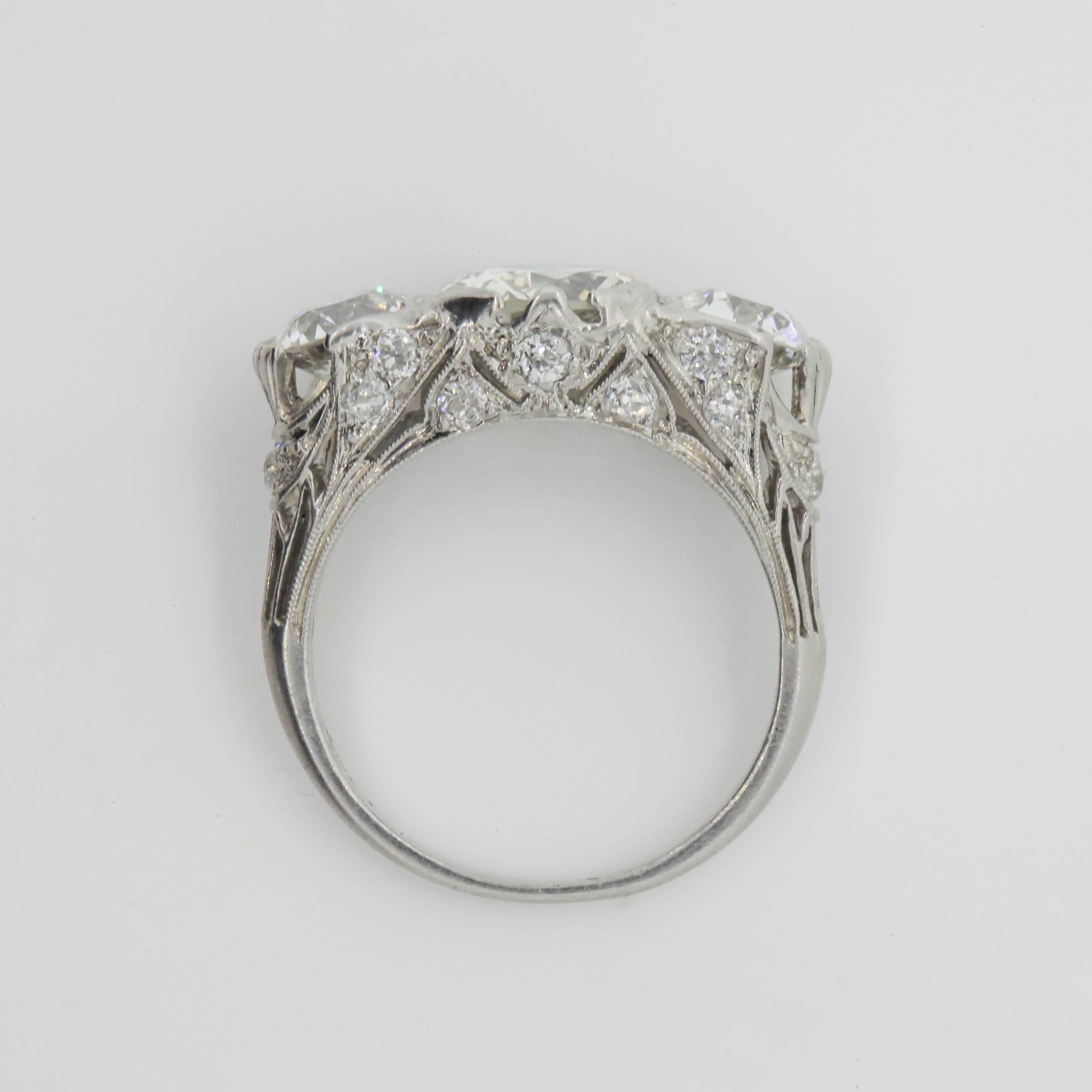 Art Deco Antique 3.58 Carat Three-Stone Old Cut Diamond Platinum Ring