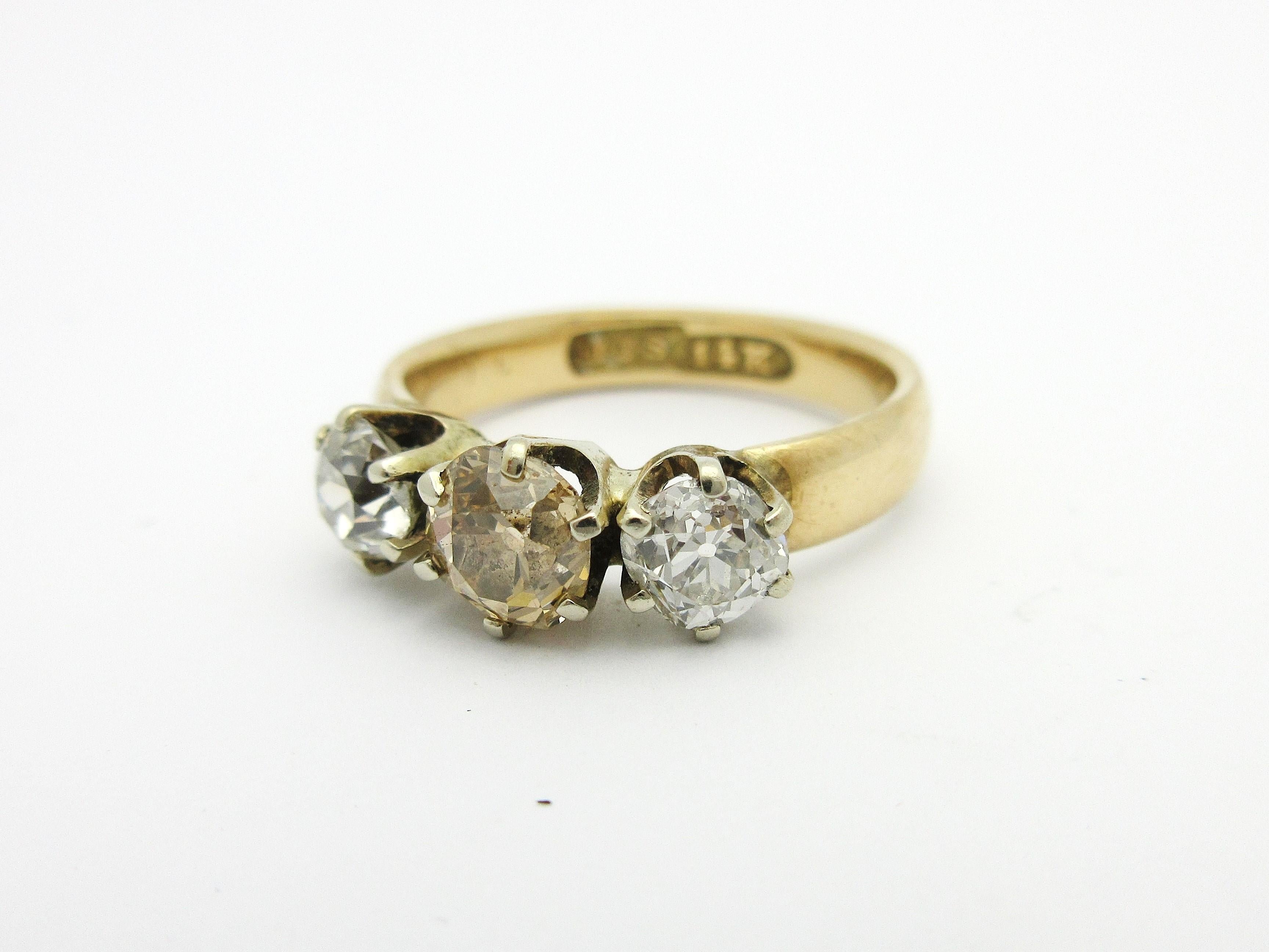 This incredible antique ring from the early 1900s was crafted by JJ Sommer Co. out of North Attleboro, Massachusetts.  

The ring contains three old mine cut diamonds in an antique 3-stone setting, each held by six white gold prongs.   The