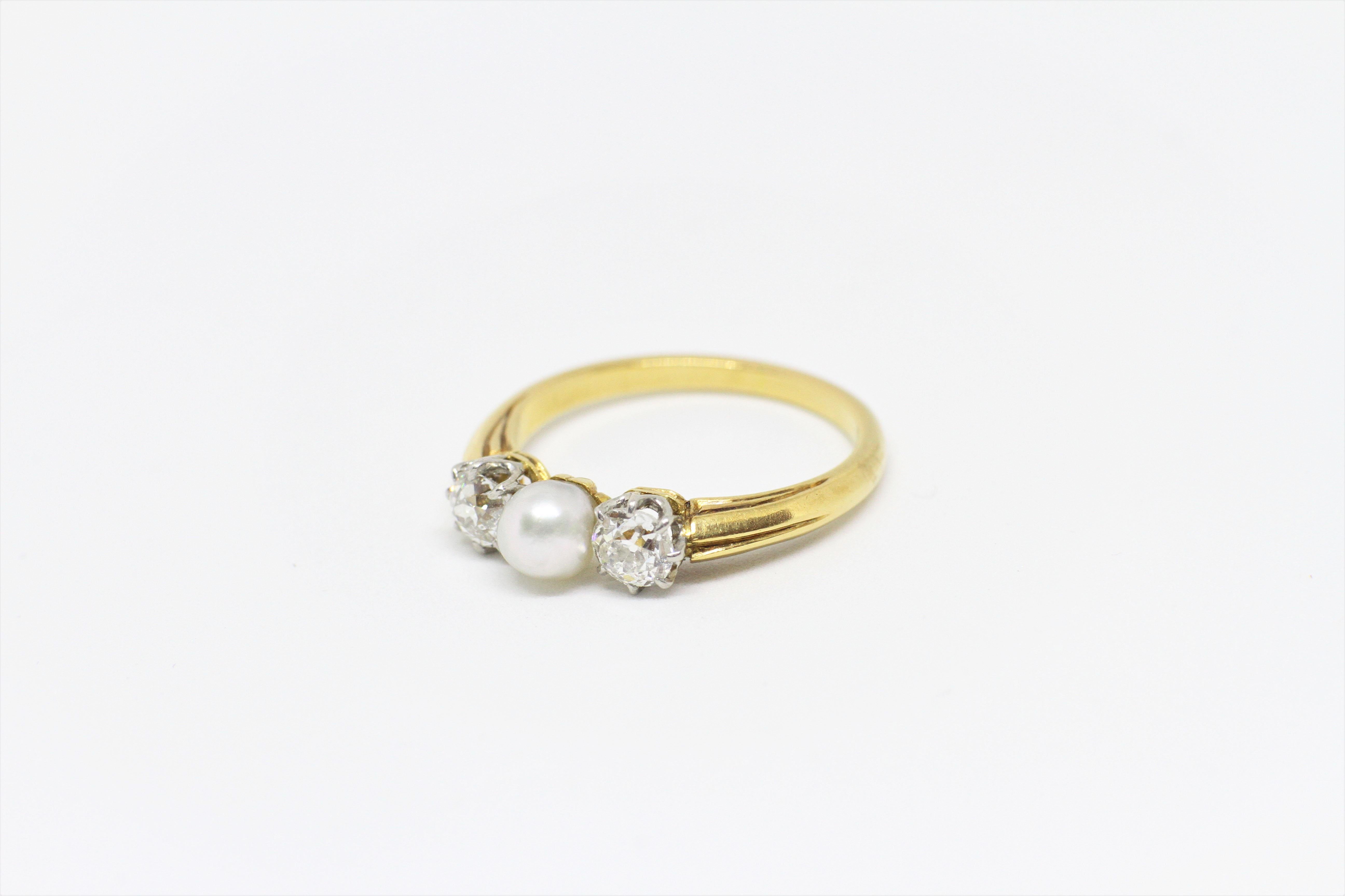 diamond ring with pearl side stones
