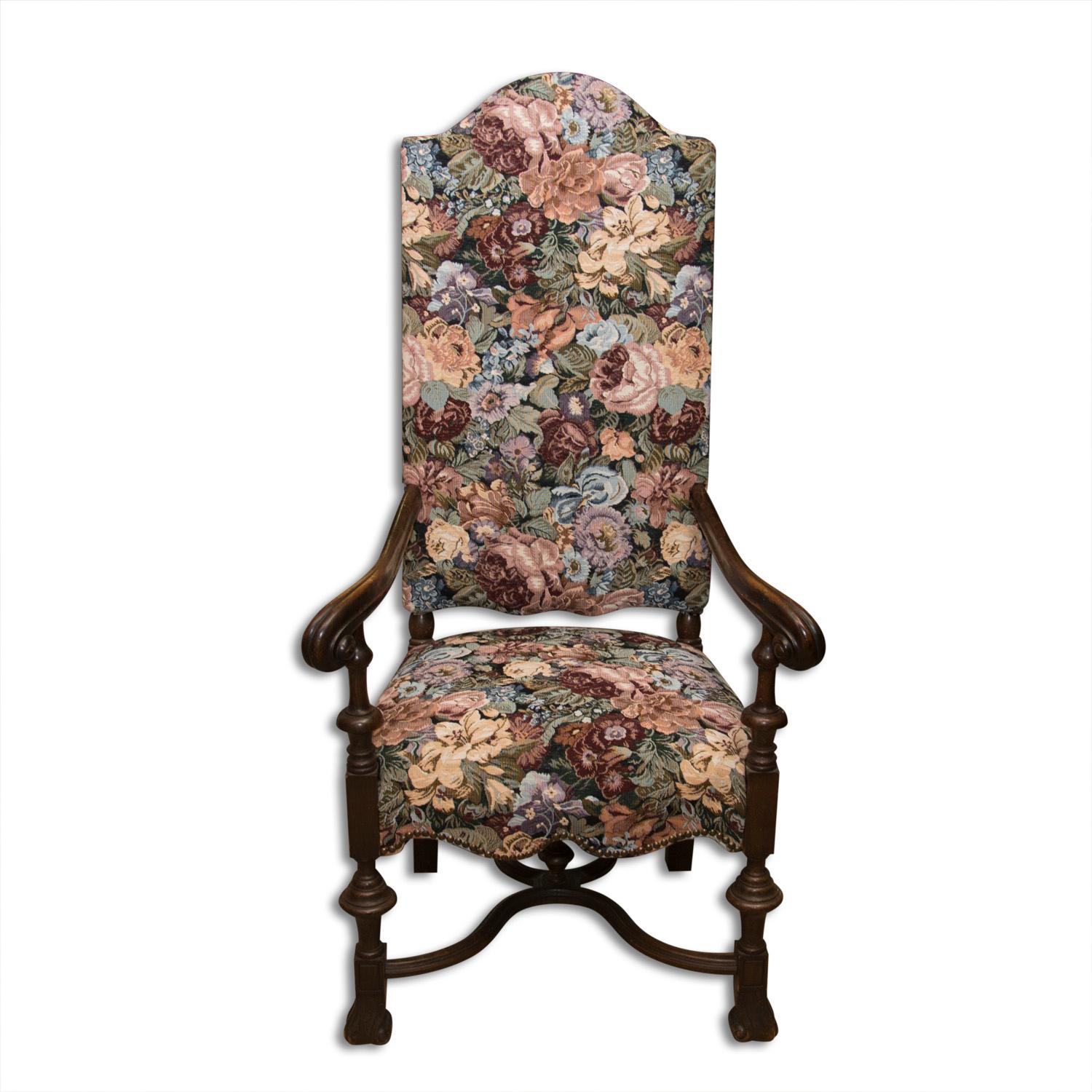 It was made of walnut wood by a skilled carver in the second half of the 19th century. Quality wide and comfortable armchair made in the spirit of aristocratic romanticism. It is decorated with elegantly shaped and wide-spread armrests with a cut