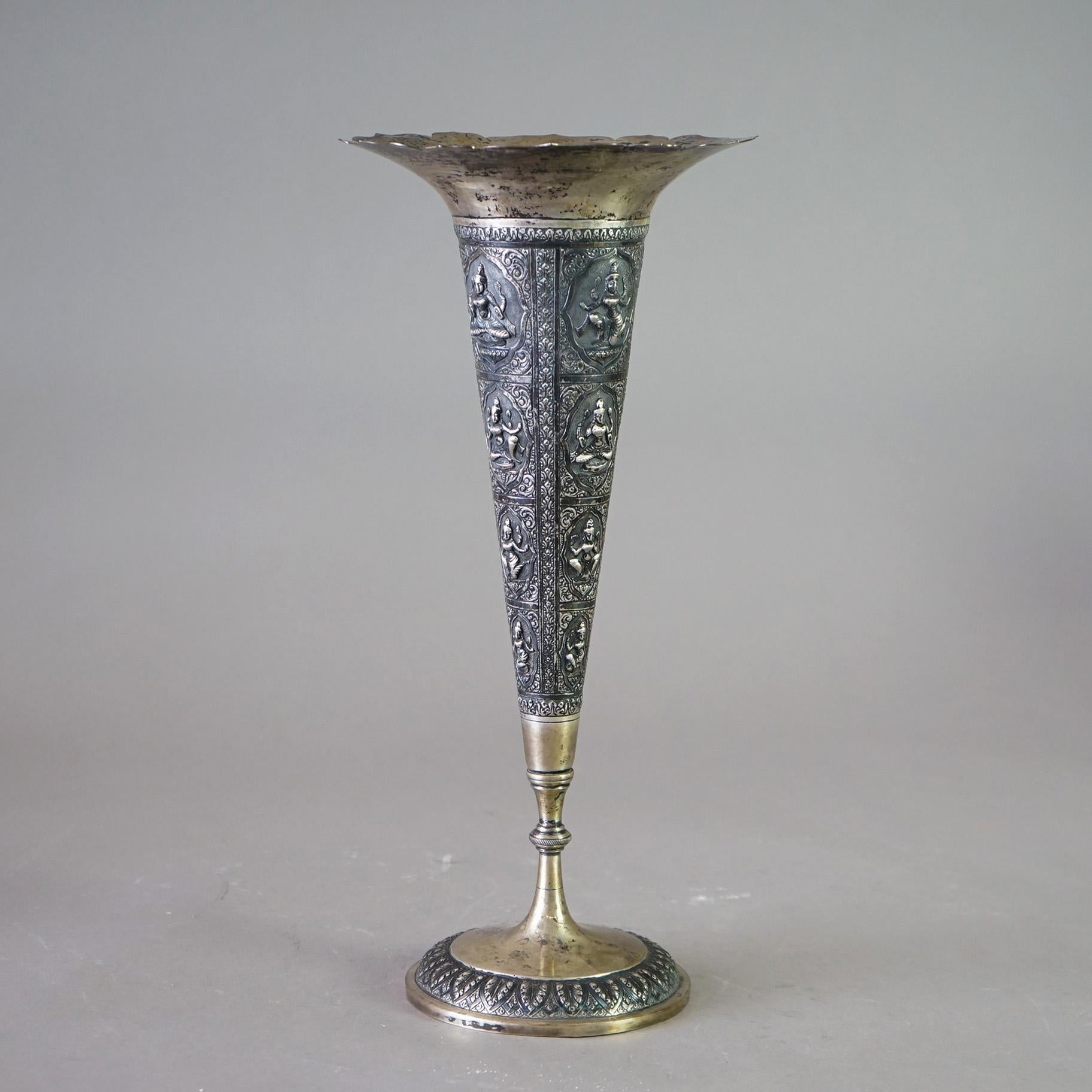 An antique Tibetan vase offers 800 silver construction in flared form, with fluted rim and having embossed reserves with Shivas, 19th century
Figural Embossed Shiva Tall Vase with Fluted Rim 

Measures - 16.5