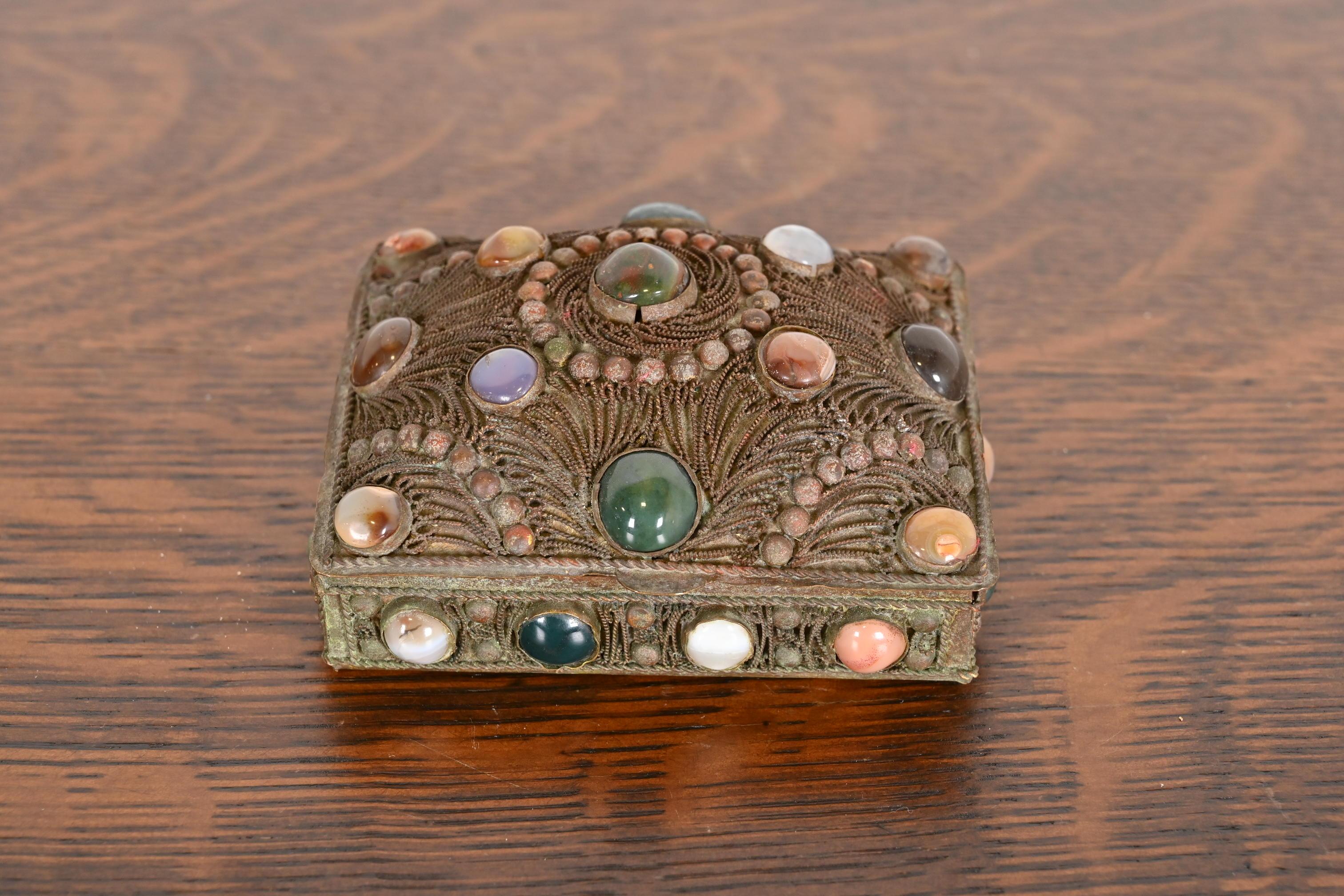 A gorgeous antique Tibetan bronze filigree and inlaid agate dresser box, jewelry box, or decorative box

China, Early 20th Century

Measures: 4.25