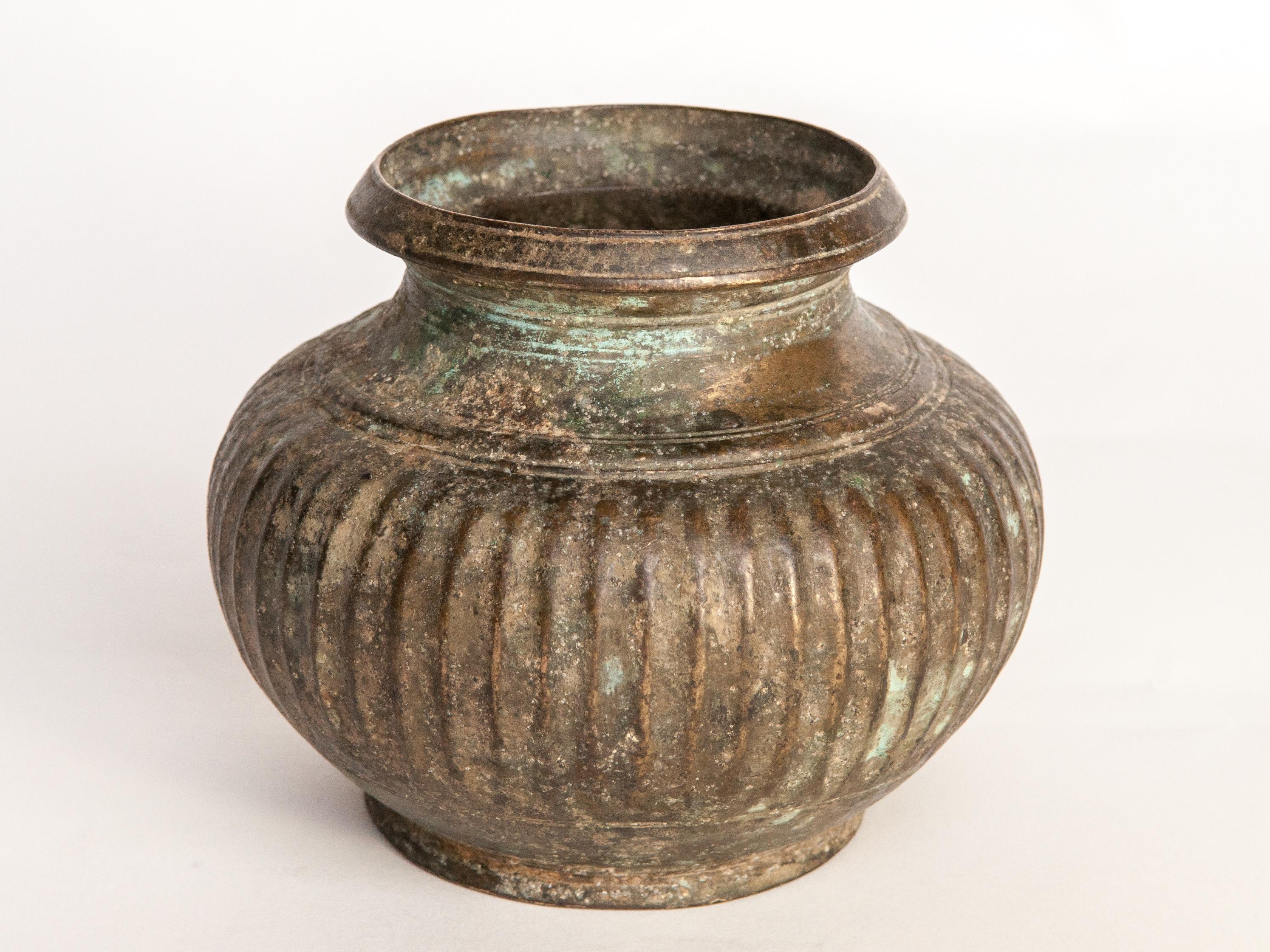 Antique Tibetan bronze pot, 18th century or earlier. Unearthed in Tibet, with a beautifully balanced shape and a lovely aged patina.
The pot is in very good condition.
Dimensions: 6 inch diameter by 4.75 inches tall.