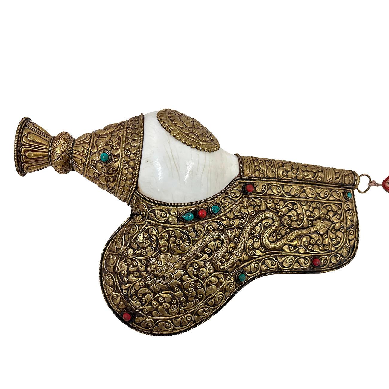 This is handcrafted Tibetan Buddhist Natural Conch Shell made from 100% natural Conch shell with Tibetan ogled, Turquoise, Coral and stones. Conch Shell are used in Buddhist worship as a trumpet or offertory vessel & symbolizes the spoken word of