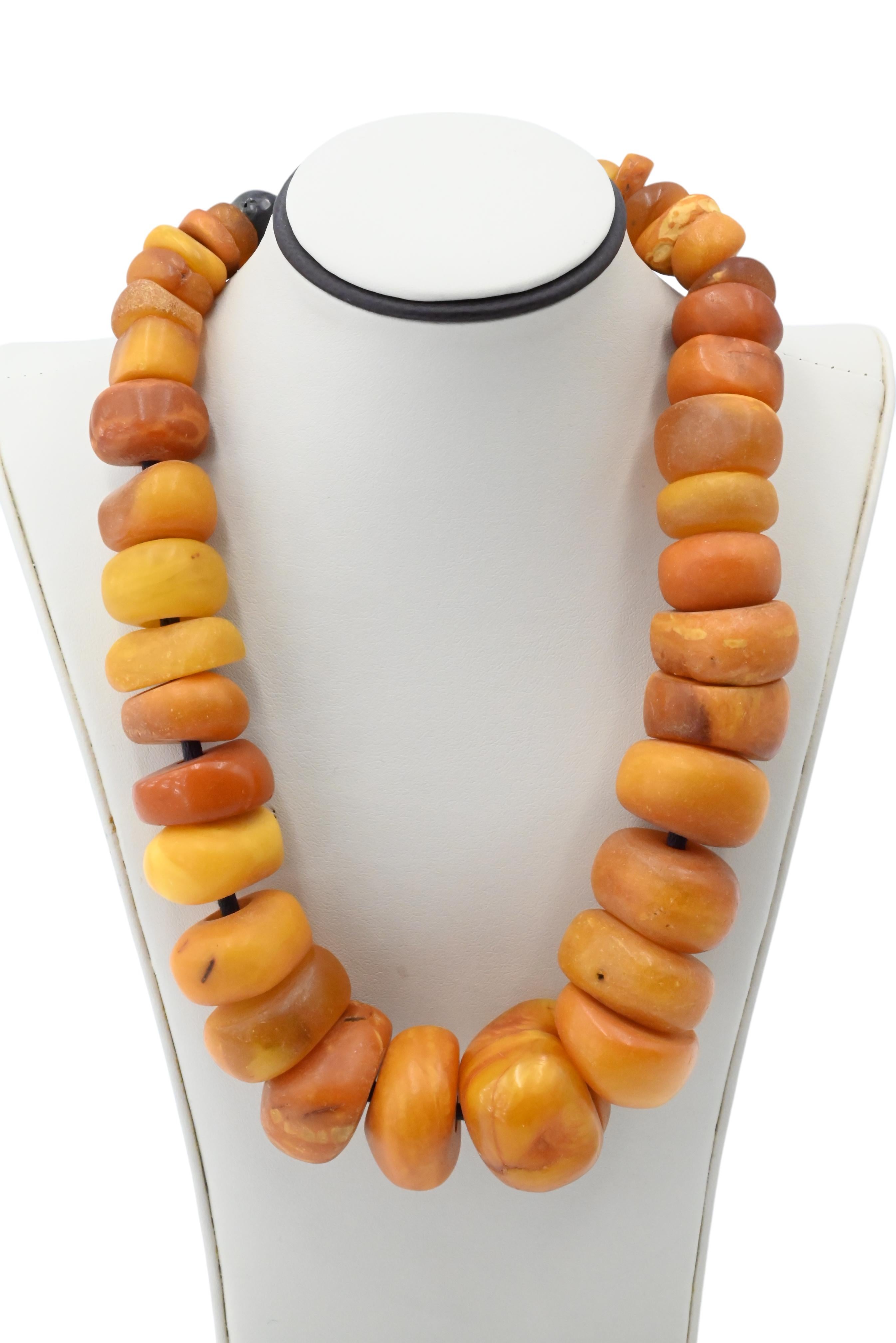 Antique Butterscotch Tibetan Amber Necklace 191 Grams 

ANTIQUE TIBETAN  BUTTERSCOTCH AMBER 
GRADUATED DONUT BEADS
MEASURES 9 1/2 INCHES LONG WHEN CLOSED
TOTAL WEIGHT 191 GRAMS
UNSIGNED - BEADS ARE STRUNG / NOT HAND KNOTTED
BRIGHT CLEAN CONDITION