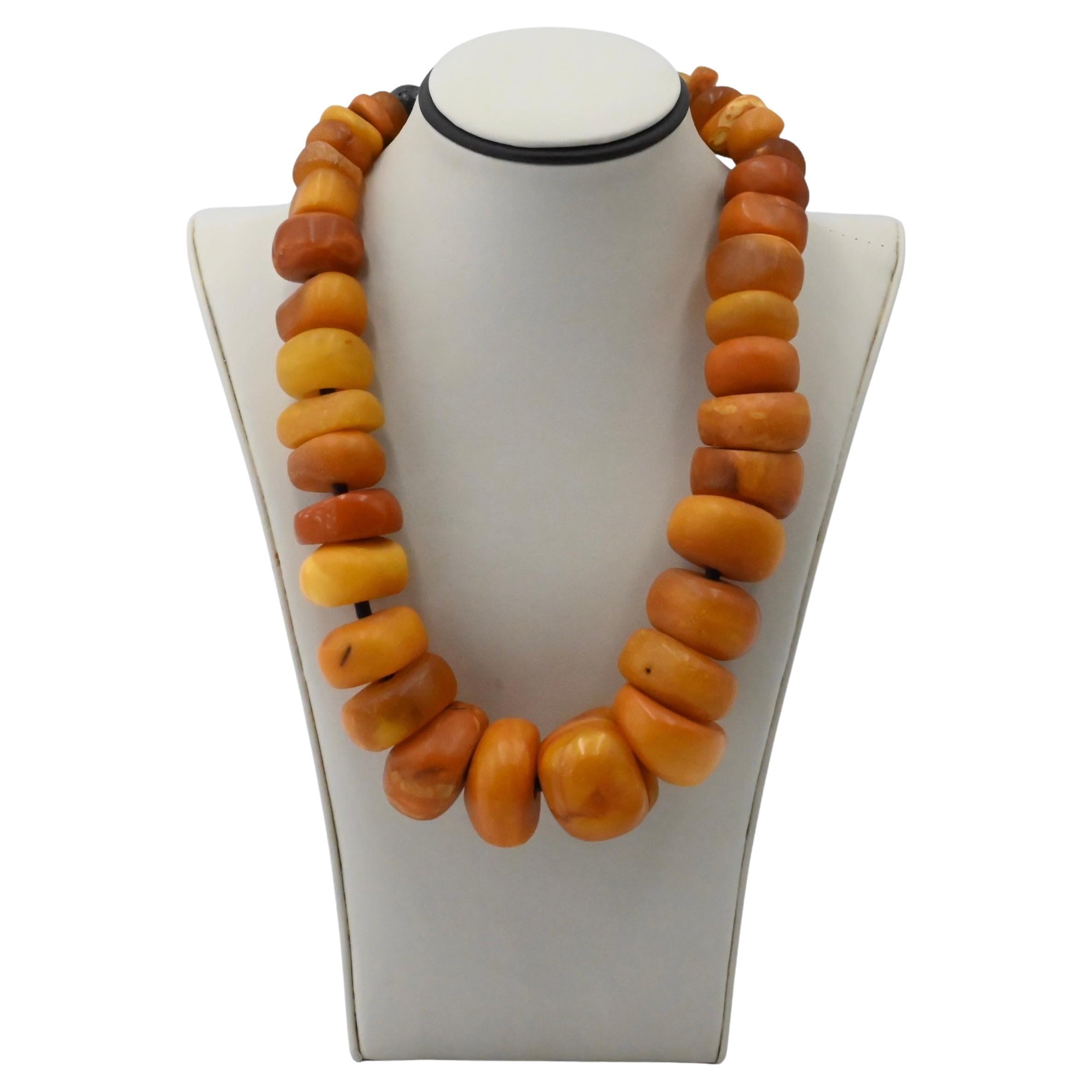 Lot 498 - Large reconstituted amber bead necklace with