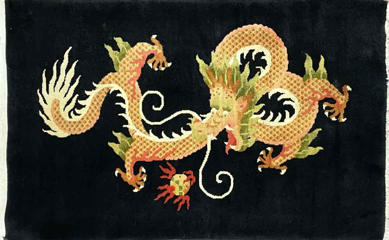 Discover the Enchanting World of Antique Tibetan Dragon Rugs

Uncover the allure of a magnificent 3' x 5' antique Tibetan dragon rug, a testament to the rich tapestry of Tibetan culture and craftsmanship. This exquisite piece boasts a deep black