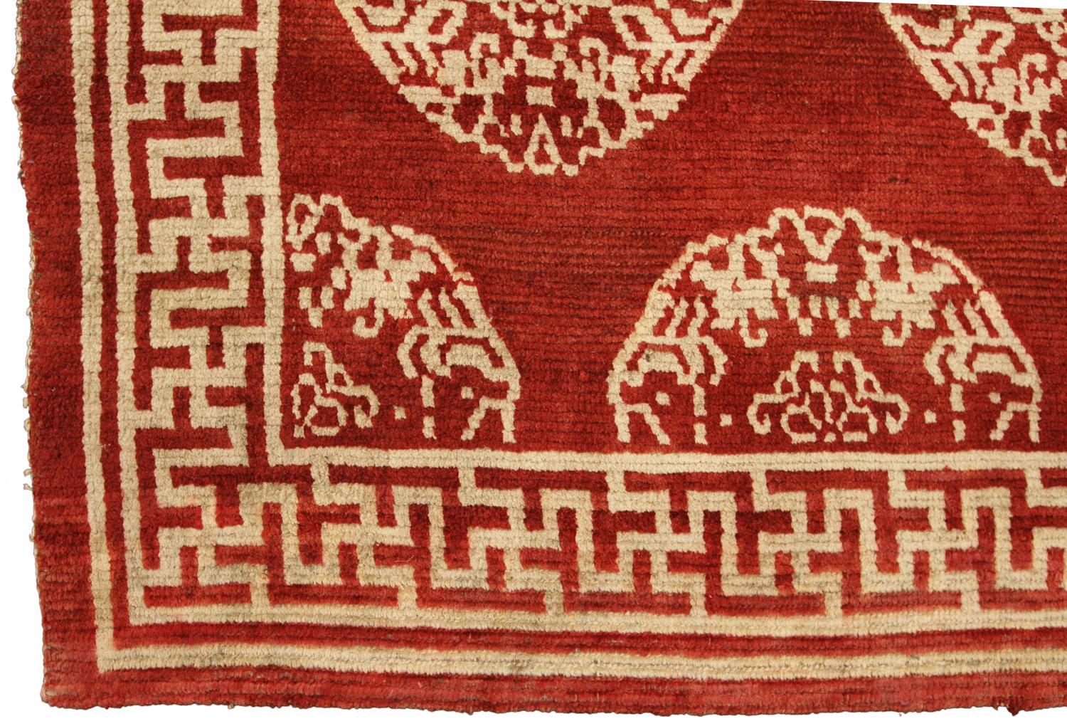 This is an antique Tibetan rug woven during the beginning of the 20th century circa 1900 and measures 156 x 80CM in size. Its field depicts five rows of highly geometric beige-colored medallions which are indicative of Tibetan and Chinese culture