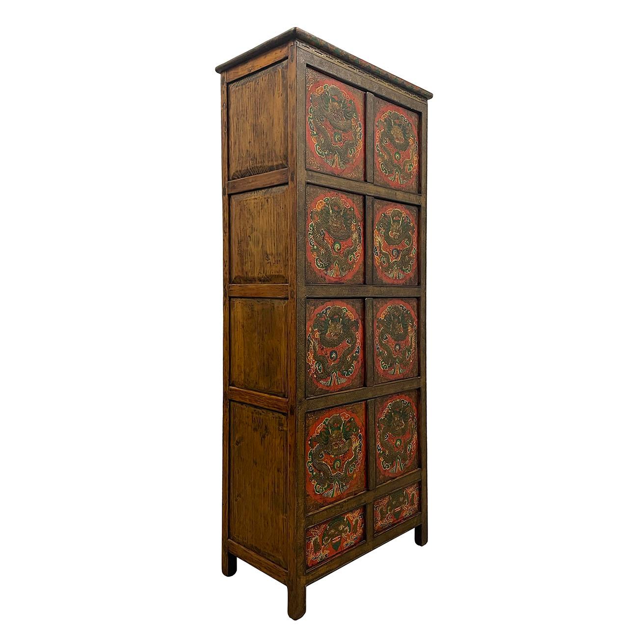 This Antique Tibetan Painted Tall Cabinet is 100% hand made and hand painted using mineral painting which last the paint a much longer time. You can see some of the finish has already been lost. This Cabinet has 4 double open doors compartment on