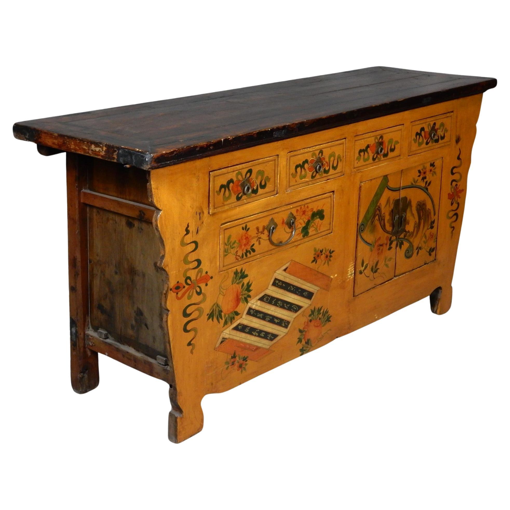 Spectaculaire meuble buffet peint et fabriqué à la main au Tibet.
5 tiroirs au total avec un espace de rangement spacieux à double porte. 
Côtés et dessus en bois ancien. Une merveilleuse pièce d'art fonctionnel.