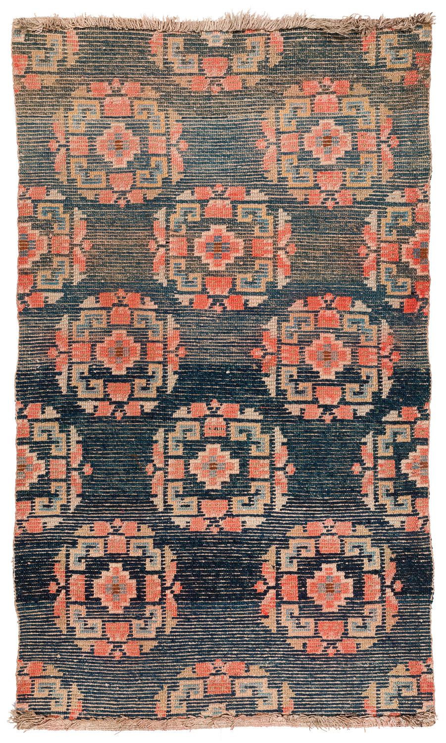 This antique Tibetan rug has very special wool, judging by its silky aspect this was woven with lambs wool. Lambs wool is reserved only for the most special carpets. The rug has magnificent indigo with lots of abrash color variation. All colors are