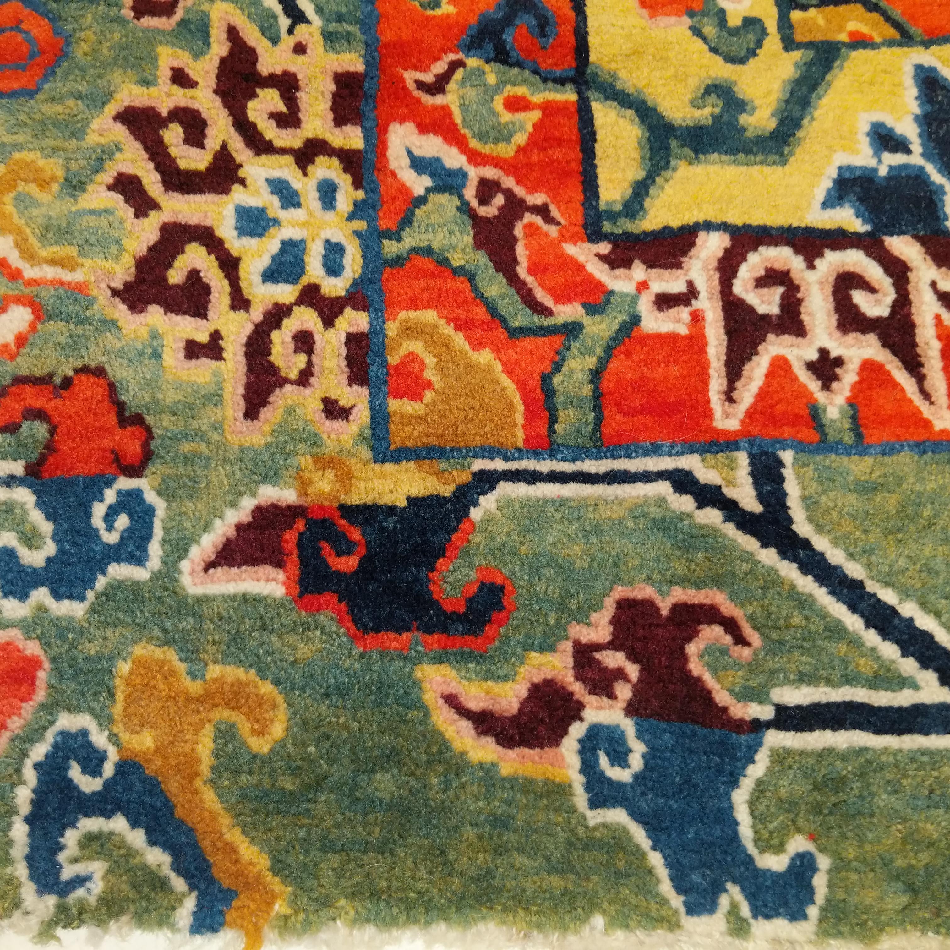 A truly special Tibetan meditation mat, quite possibly commissioned for a High Lama, decorated by the so-called brocade square pattern, a design based on the patchwork of silk brocaded textiles. It's composed of three different brocade designs,