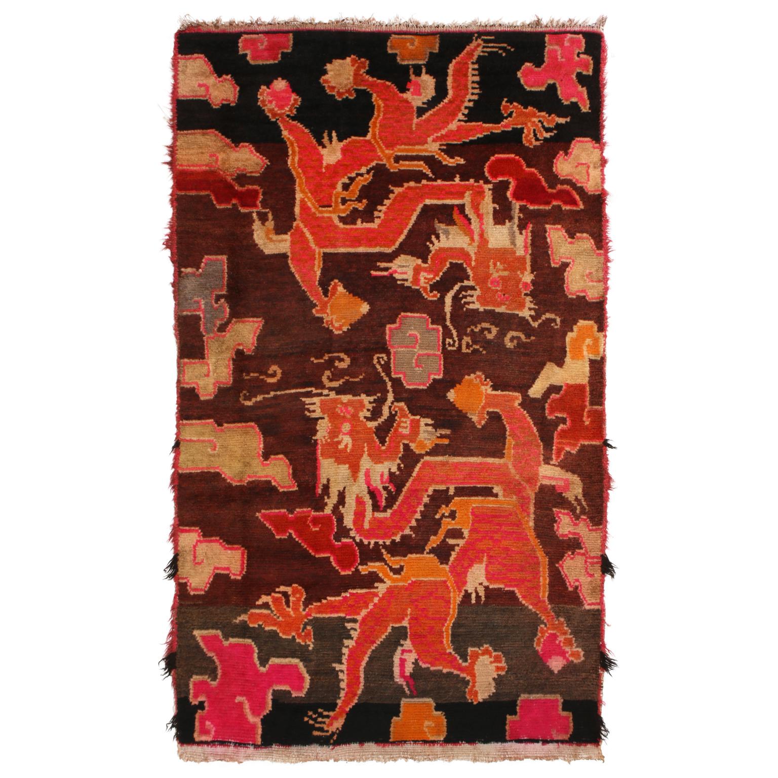Antique Tibetan Orange and Brown Wool Rug with Dragon and Cloud Motifs 1