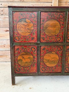 Antique Tibetan Polychrome Painted Cabinet With Animal and Floral Panels