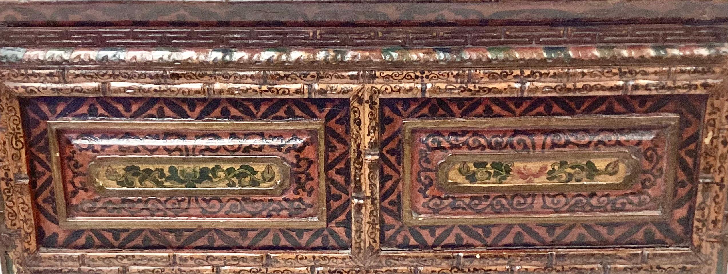 Beautifully hand-painted Tibetan chest, used by Buddhist monks in a temple for praying and storing prayer books. Chest has one drawer (pulls out from end--see pics). Chest is made of wood with a floral and foliage design in dark brown, tan and
