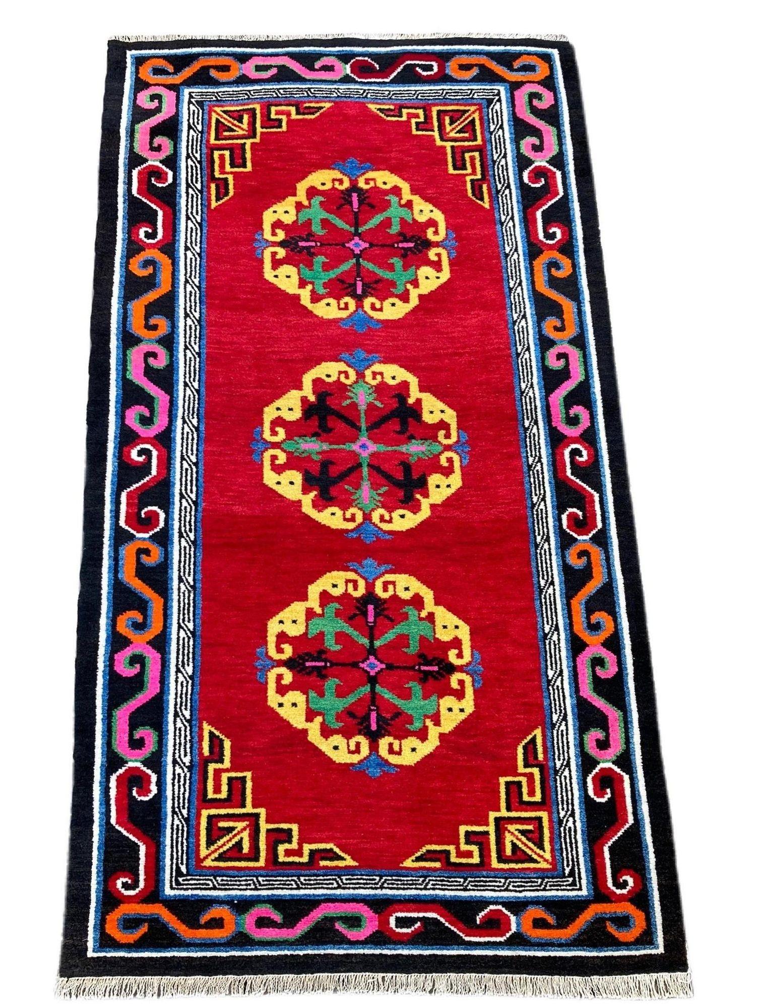 A bright and cheery antique Tibetan rug, handwoven circa 1920 with a three medallion design on a tomato red field. Lovely wool quality and rather funky secondary colours!
Size: 1.70m x 0..97m (5ft 7in x 3ft 2in)
This rug is in good condition with