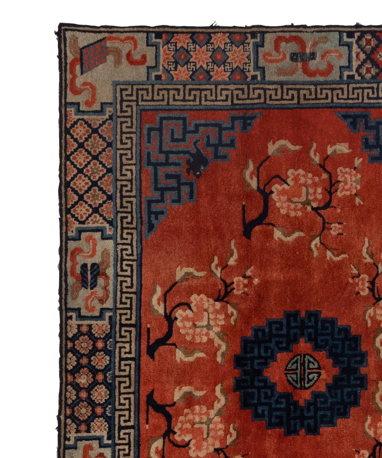 This is a breathtaking antique Tibetan rug dating back to the 1900s. The rug is in pristine condition and its intricate design features a stunning medallion at the center, making it a truly extraordinary item. This remarkable work of art is