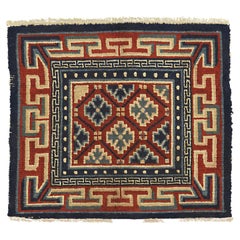 Antiker tibetischer Teppich mit Schneeflockenmuster und mehrfarbigem Medaillon, 1900-1920