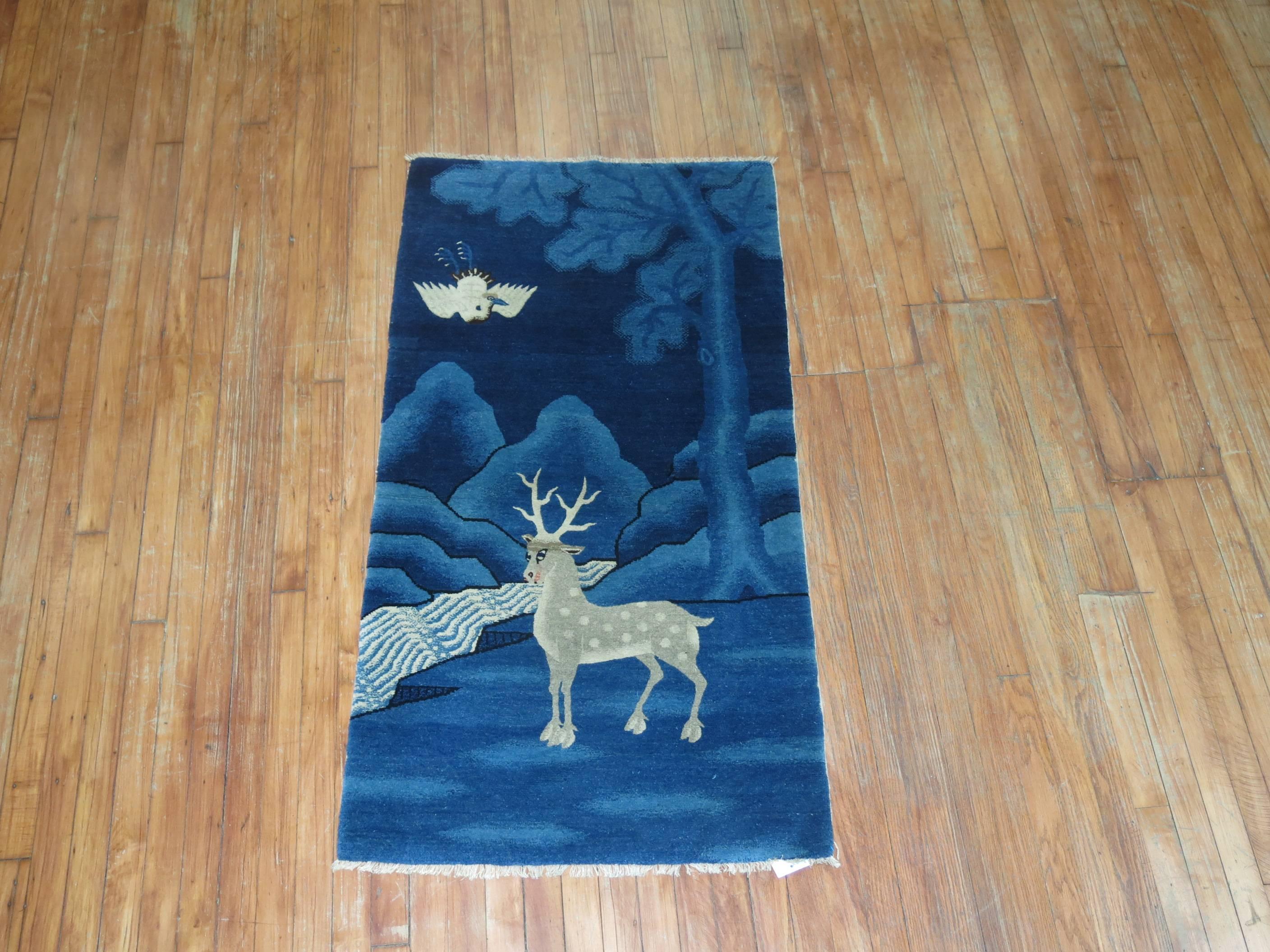 An antique Tibetan rug with a graceful deer on a classic blue ground. Background color is 2020 Pantone Color of the Year Classic Blue 19-4052

Tibetan rug making is an ancient, traditional craft. Tibetan rugs are traditionally made from Tibetan