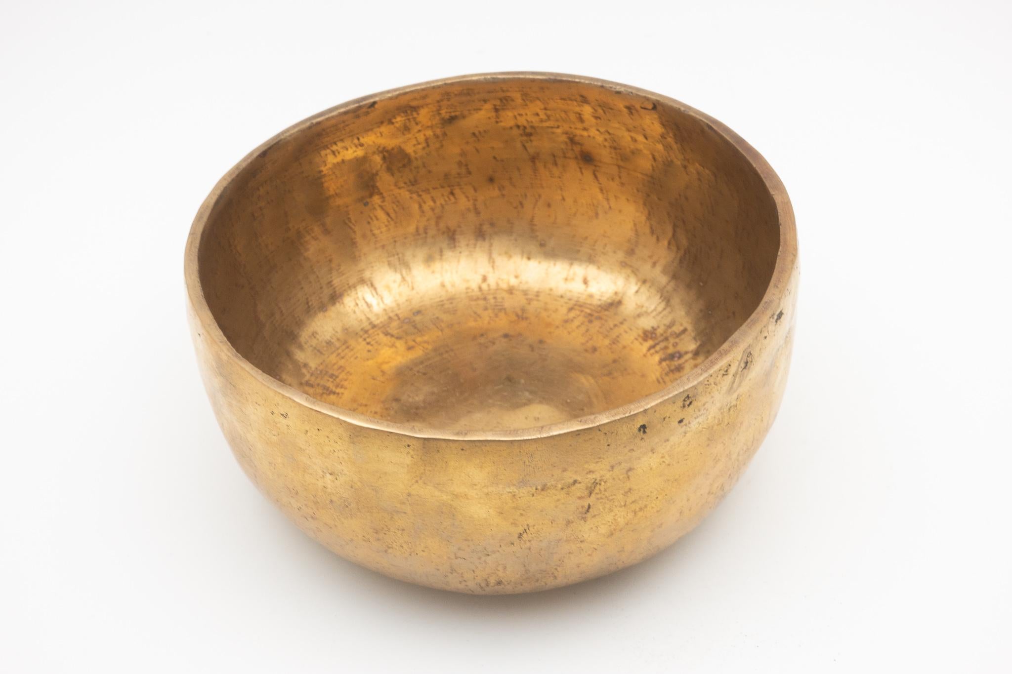 Antique bronze Tibetan singing bowl with wood and leather mallet/striker. Singing bowls. are used in some Buddhist religious practices to accompany periods of meditation and chanting. They are widely used for music making, meditation and relaxation,