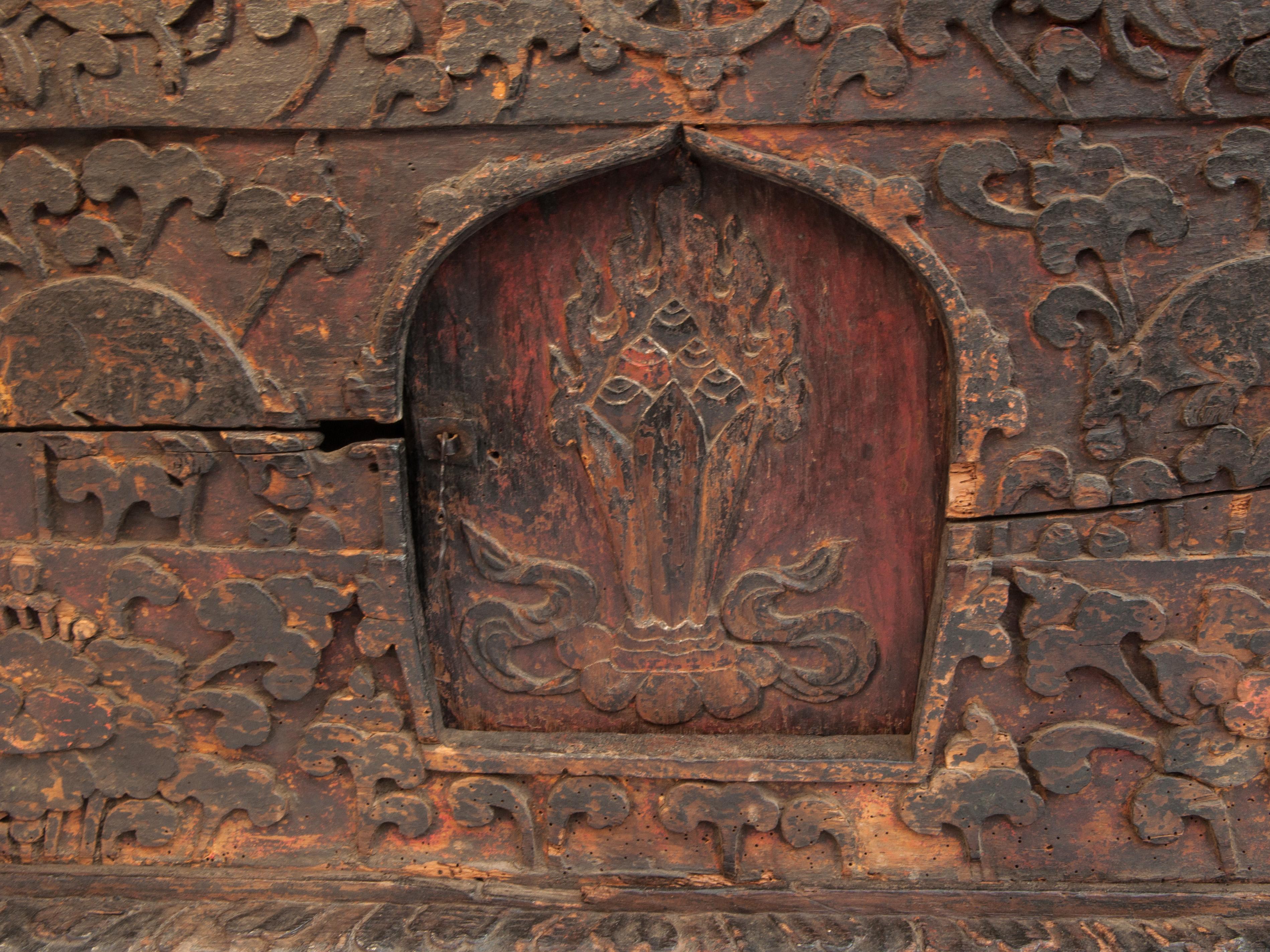 Antique Tibetan style religious storage box / table from Bhutan, 19th century or earlier.
This type of box would have been most commonly found in a village monastery, where it would have been used to store especially important thangkas (Tibetan