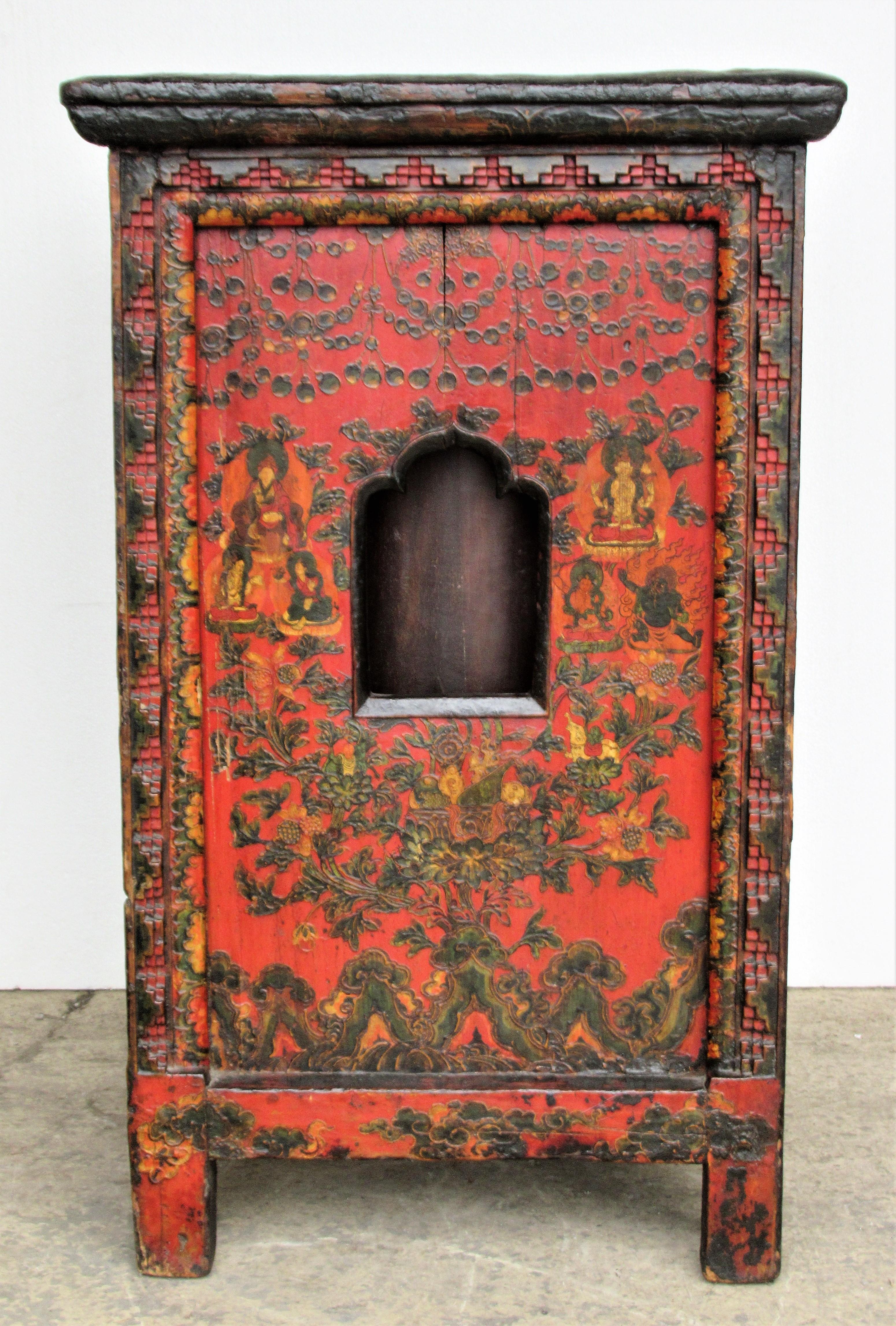 Antique Tibetan prayer wheel altar table with beautifully aged original rich jewel tone colors of fine polychrome painted decorations- Buddha, other figures, elephant, lanterns, floral, berries. All-over low and high relief carving at front / side