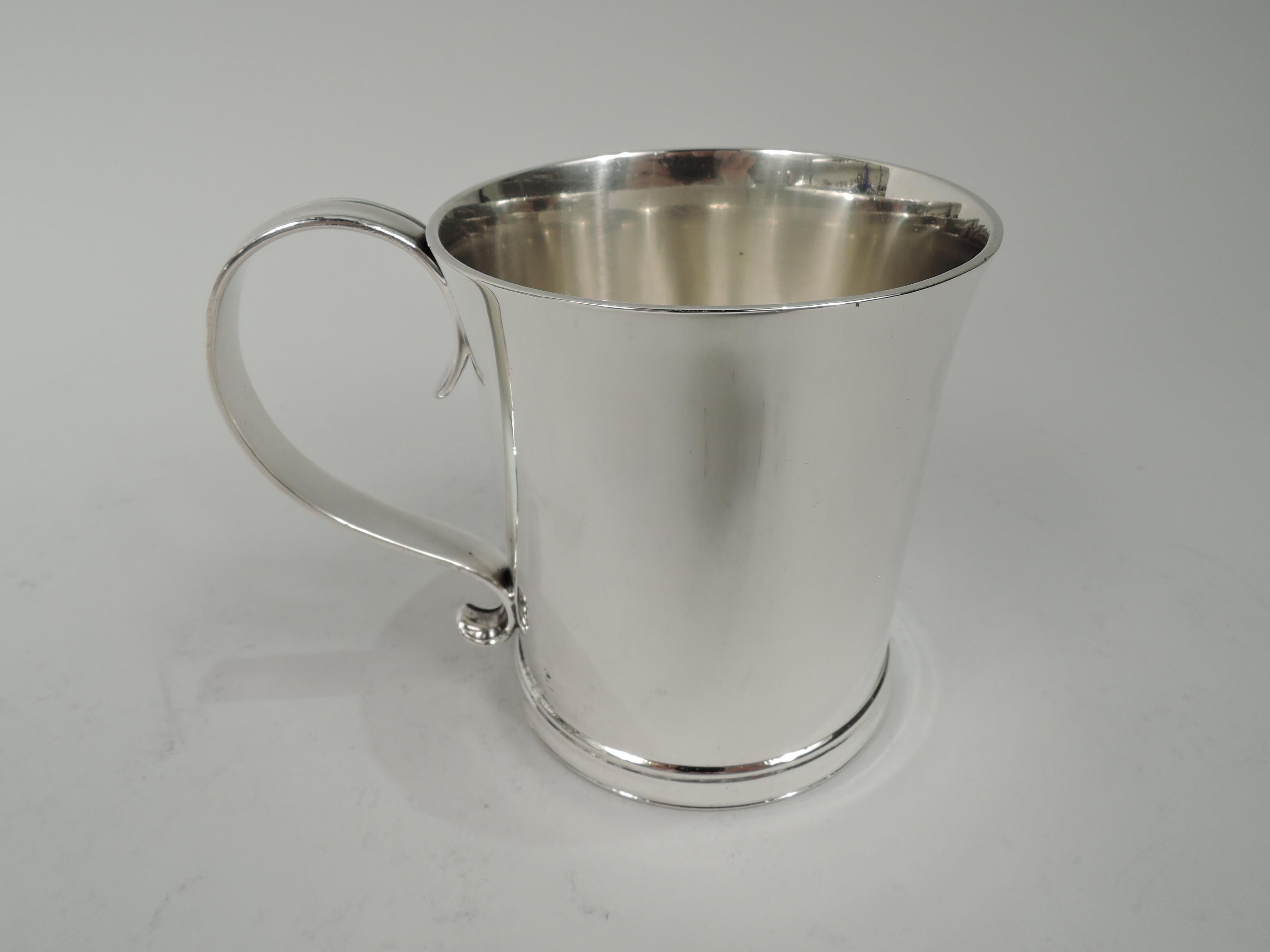 Colonial Revival sterling silver baby cup. Made by Tiffany & Co. in New York, ca 1916. Straight sides with gently flared rim, s-scroll handle and molded base. Lots of room for engraving. Fully marked including maker’s stamp, pattern no. 19184 (first