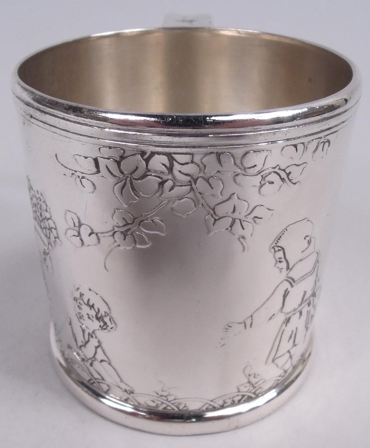 Art Deco sterling silver baby cup. Made by Tiffany & Co. in New York, ca 1927. Gently upward tapering sides and bracket handle. Acid-etched frieze depicting child gardeners lugging water cans and pushing wheelbarrows. Front vacant for engraving the