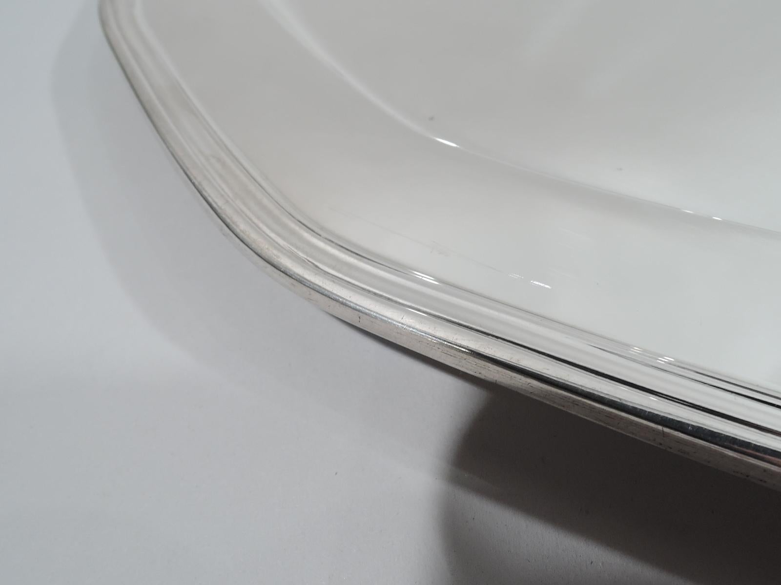 Art Deco sterling silver tray. Made by Tiffany & Co. in New York, ca 1926. Faceted with deep well and molded rim. Fully marked including pattern no. 20774 (first produced in 1926) and director’s letter m. Heavy weight: 26 troy ounces.