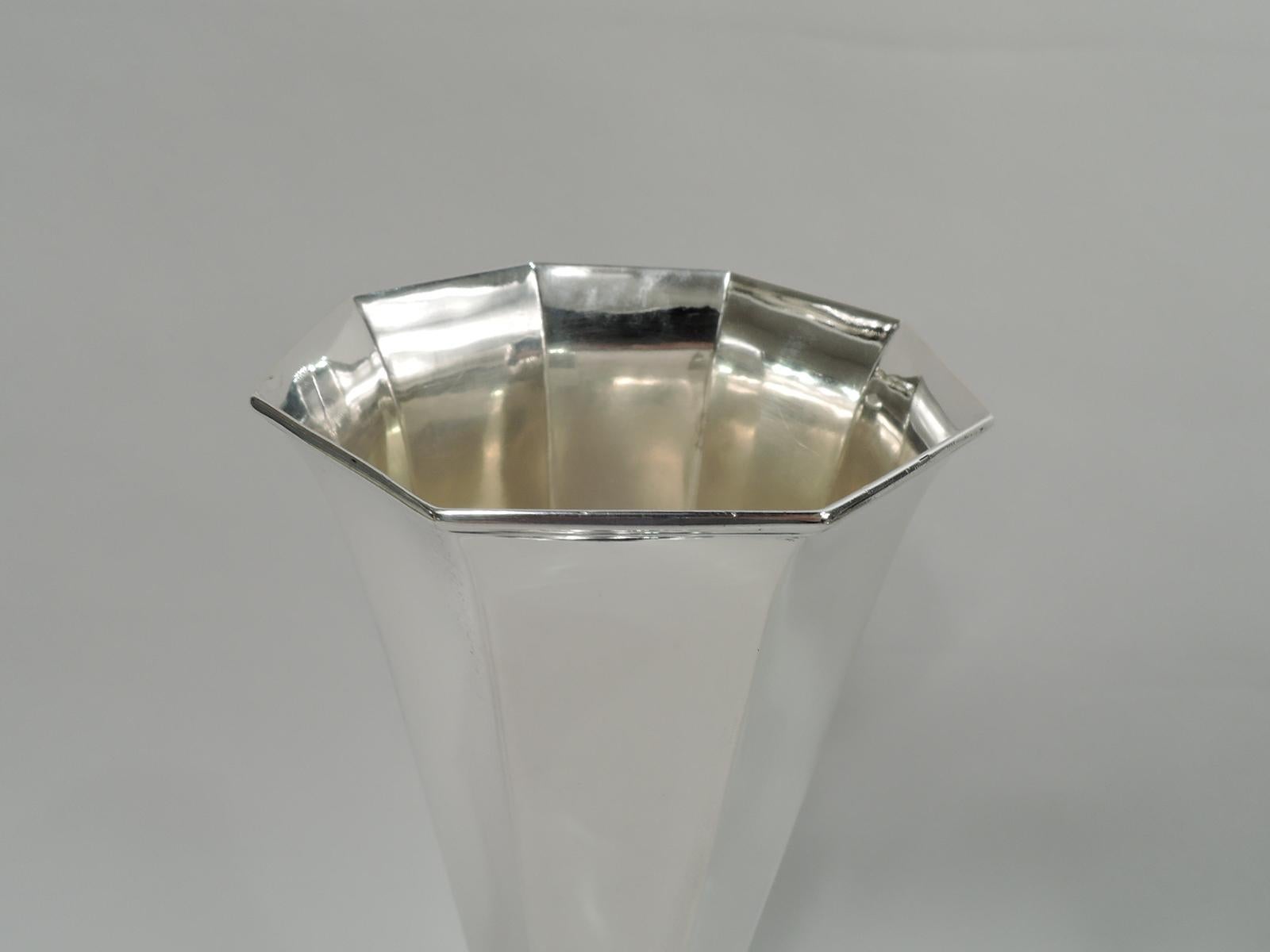 Art Deco sterling silver trumpet vase. Made by Tiffany & Co. in New York, ca 1914. Straight, tapering and faceted sides. Foot raised and same. Fully marked including maker’s stamp, pattern no. 18700 (first produced in 1914), and director’s letter m.