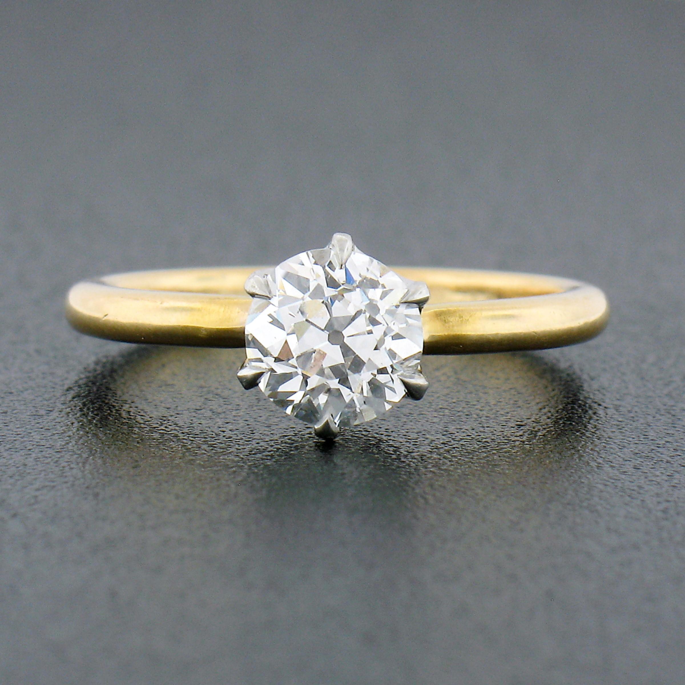 Here we have an absolutely gorgeous antique, Tiffany & Co., diamond solitaire engagement ring that was crafted during the Edwardian era from solid 18k yellow gold and platinum. It features a, GIA certified, old European cut diamond that is neatly