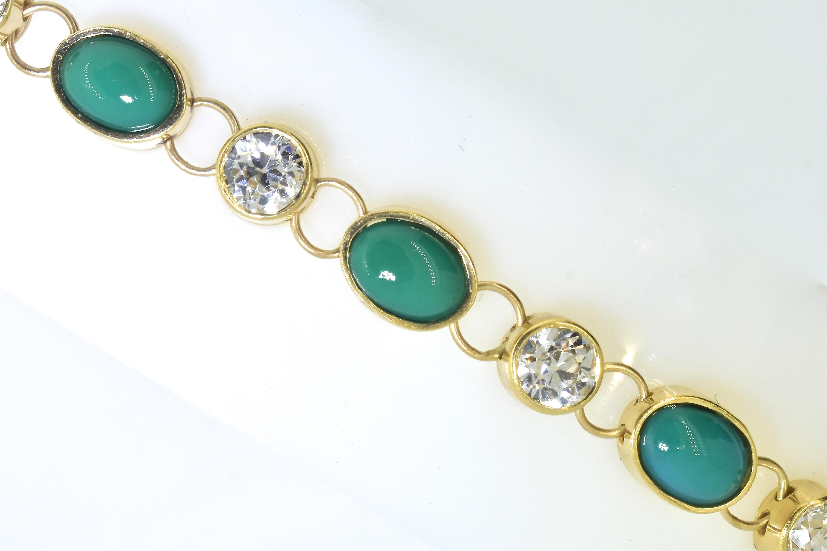 Tiffany & Company 18K yellow gold bracelet set with fine old European cut diamonds and natural turquoise.  The 6 diamonds are all well matched in cut and symmetry.  They are near colorless, (H,I) and very slightly included (VS).  There is an