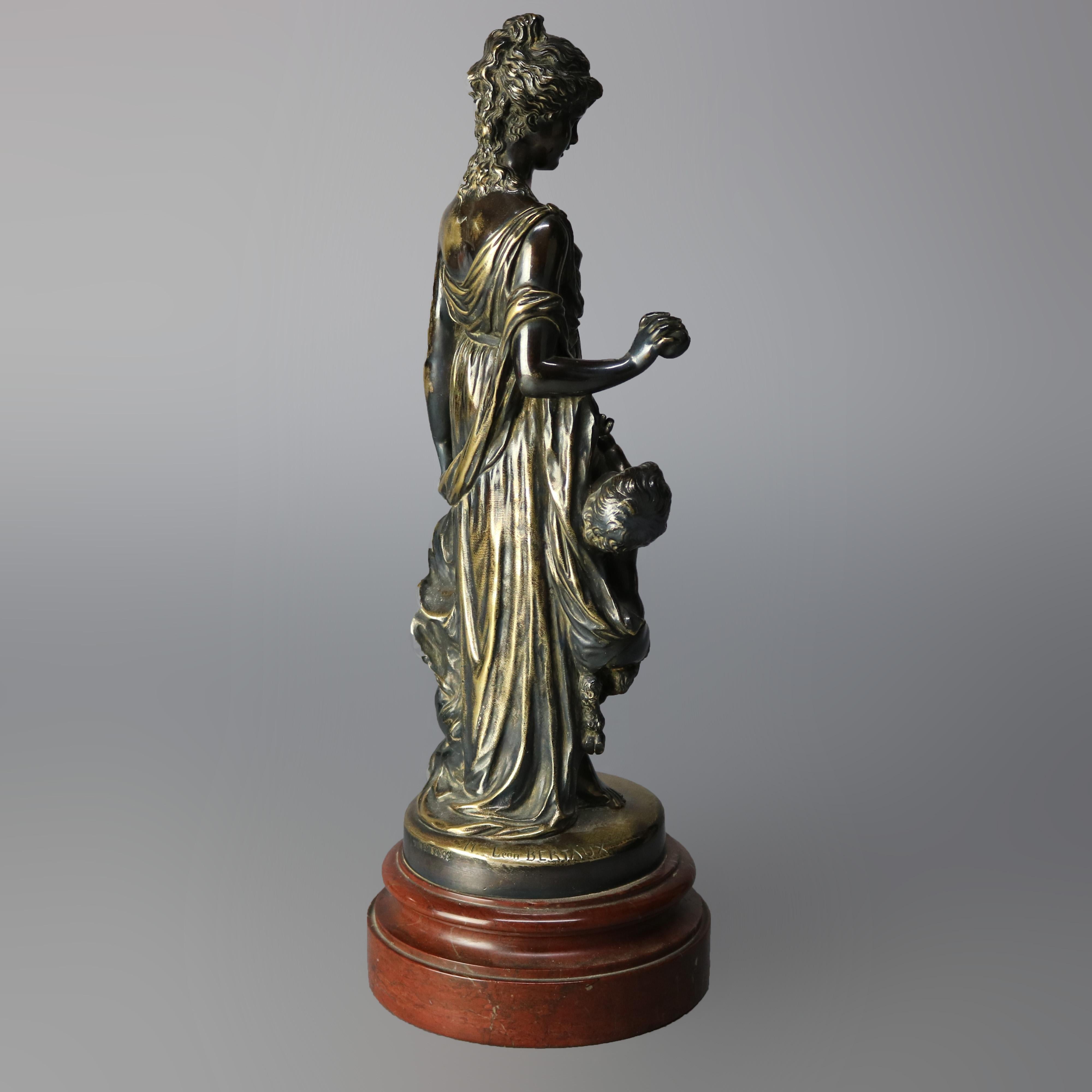 An antique classical Greek bronze sculpture by Leon Bertaux (France, 1825-1901) for Tiffany & Co. depicts woman with children or Greek goddess with putti, seated on marble plinth, signed as photographed, circa 1890

Measures: 14